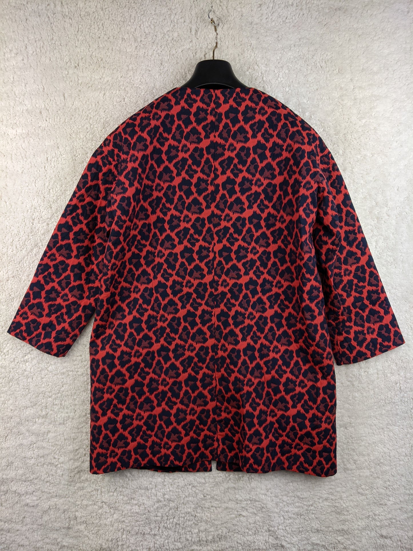 Back view of WE red and black leopard print coat