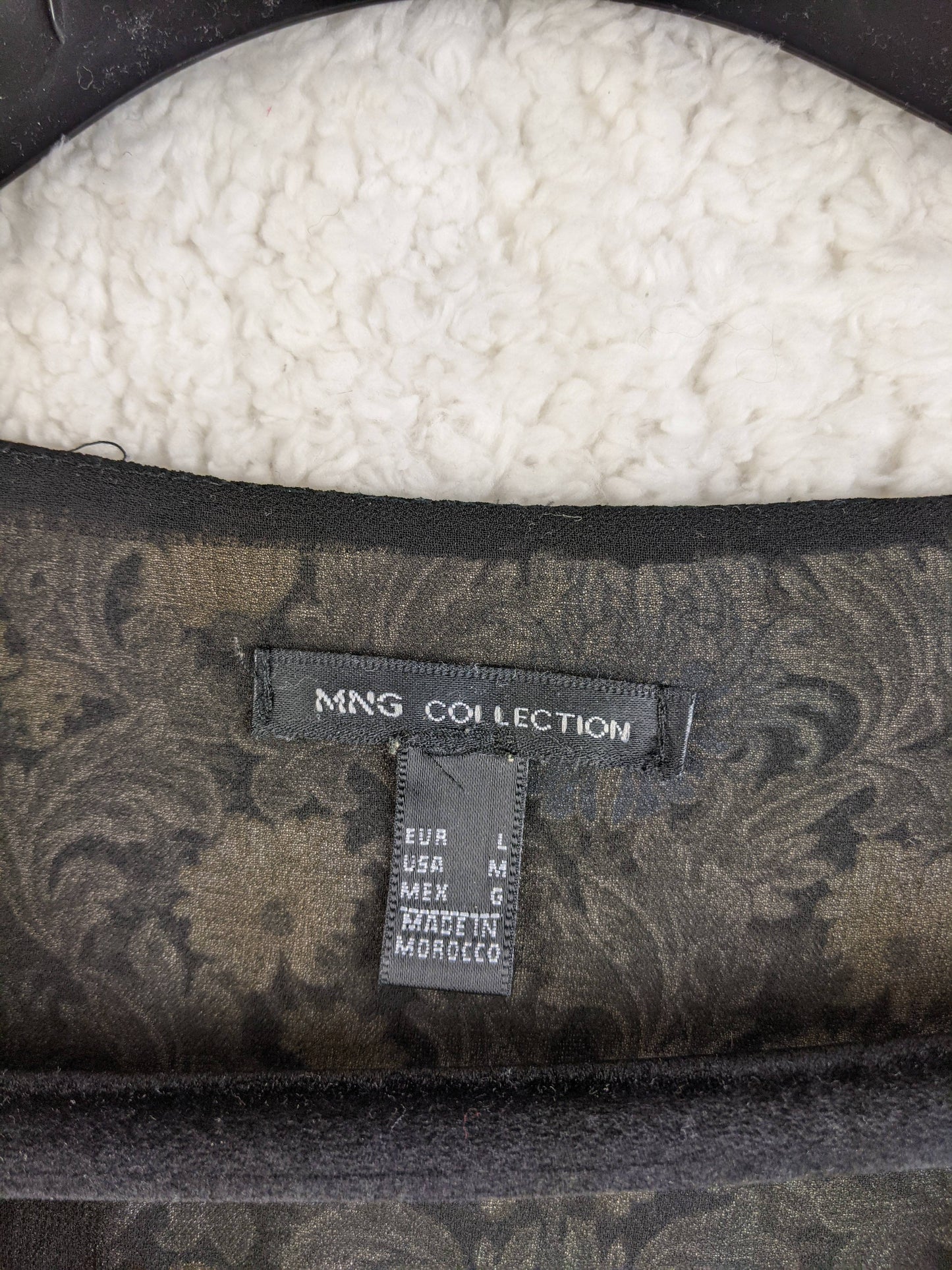 Close-up of the MNG Collection label and size tag