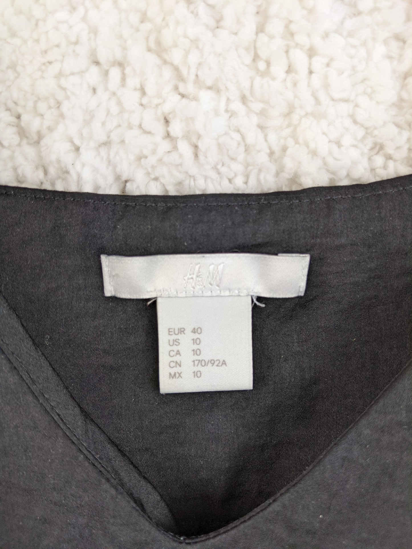 Label of H&M camisole showing size and brand