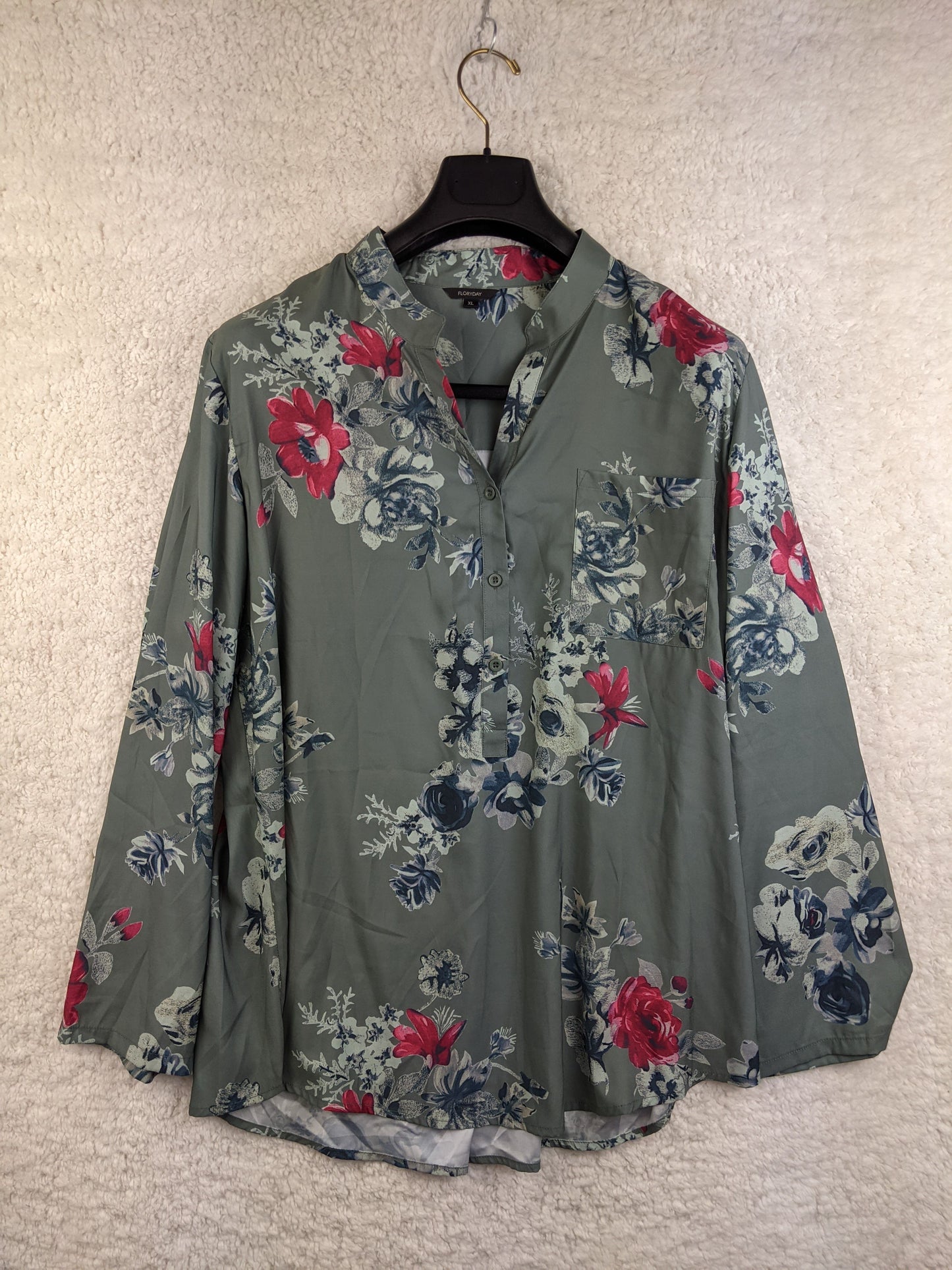 Front view of green floral blouse