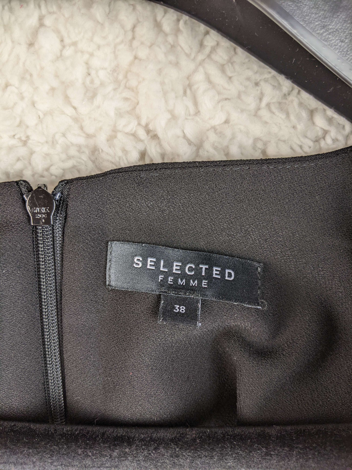 Close-up of Selected Femme label on dress