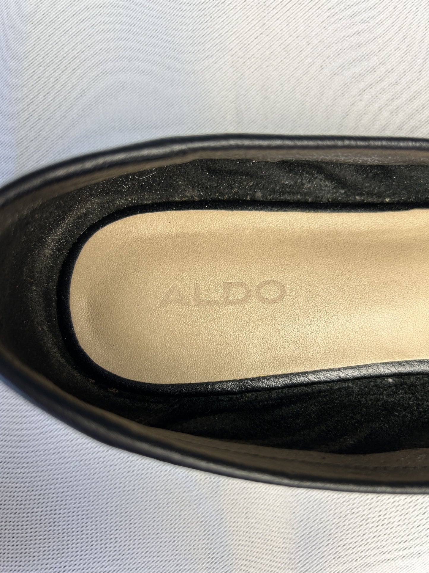 Close-up of Aldo branding inside the shoe