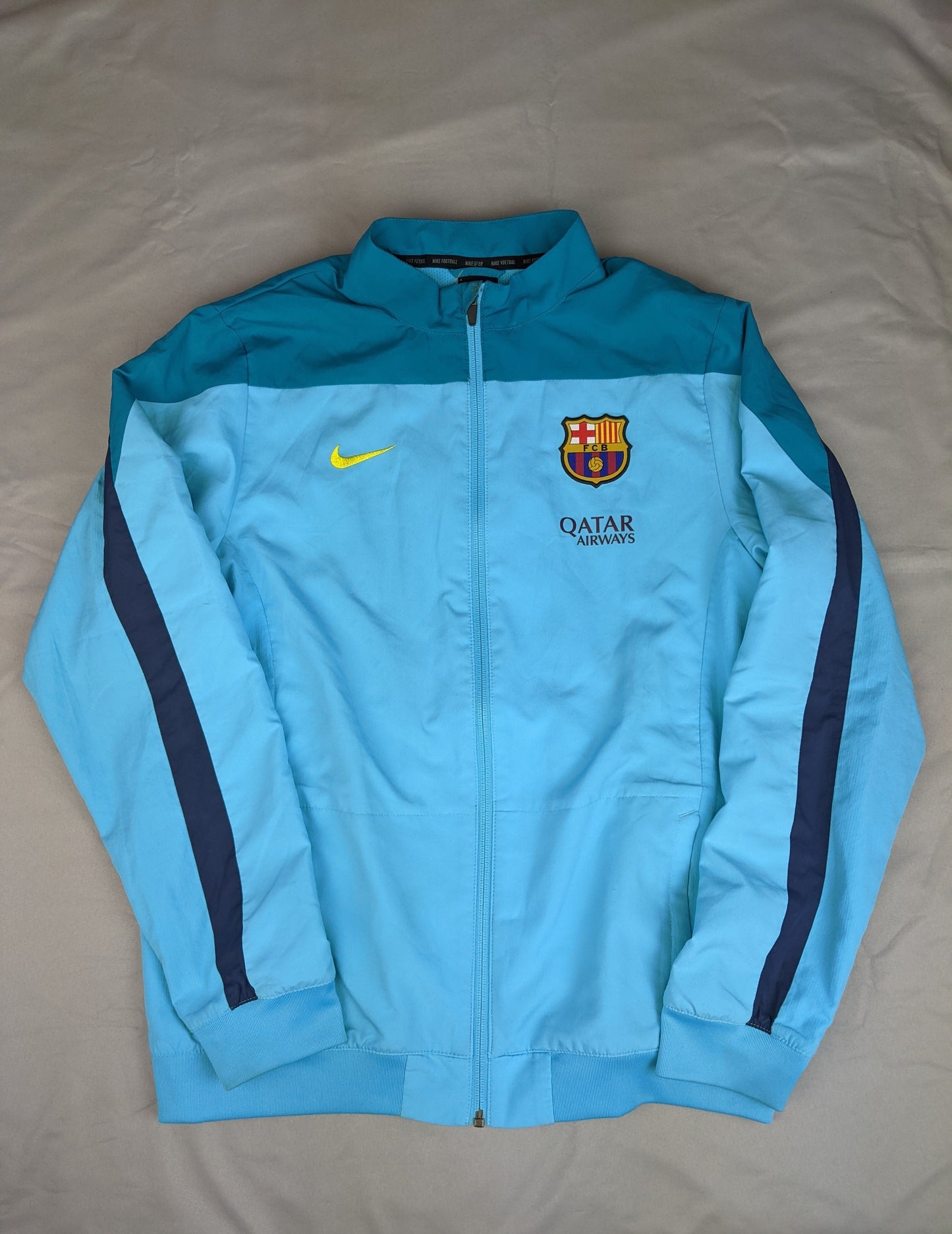 Front view of blue Nike FC Barcelona track jacket