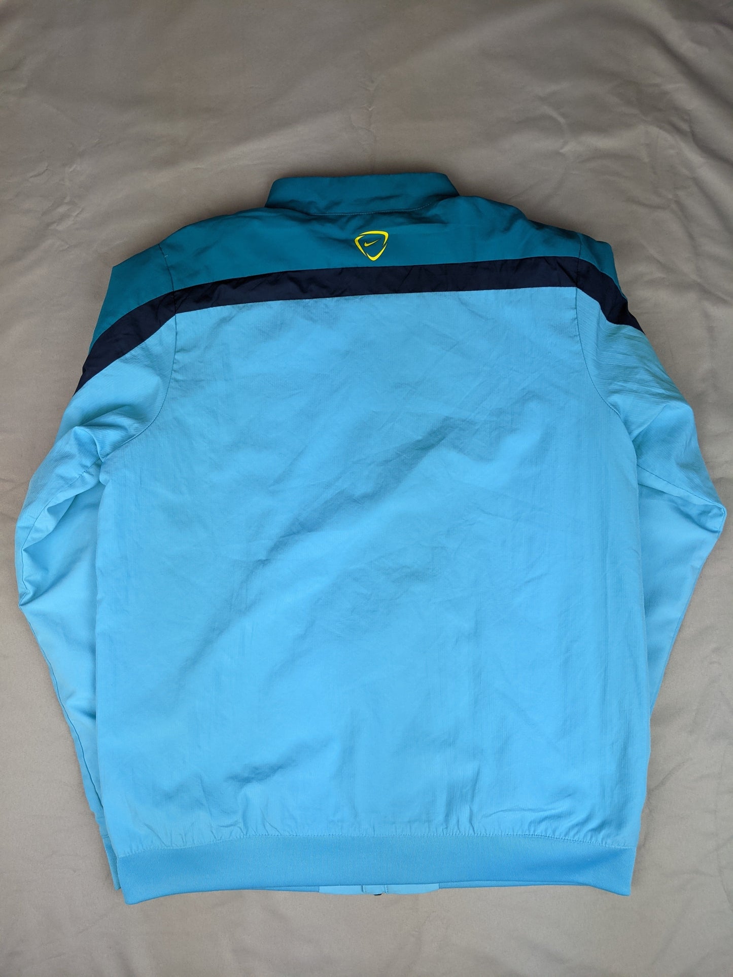 Back view of blue Nike FC Barcelona track jacket