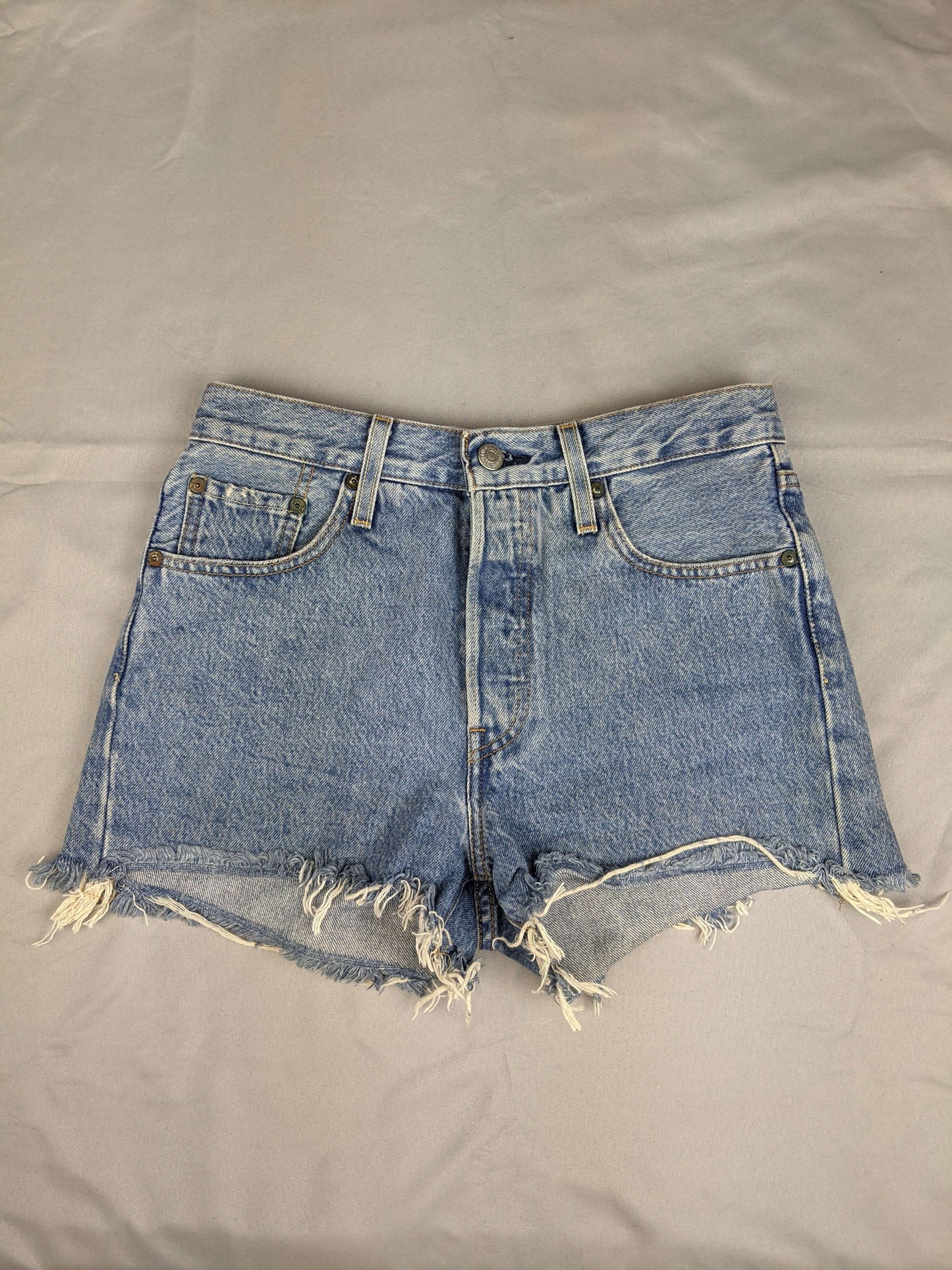 Front view of Levi's blue denim shorts