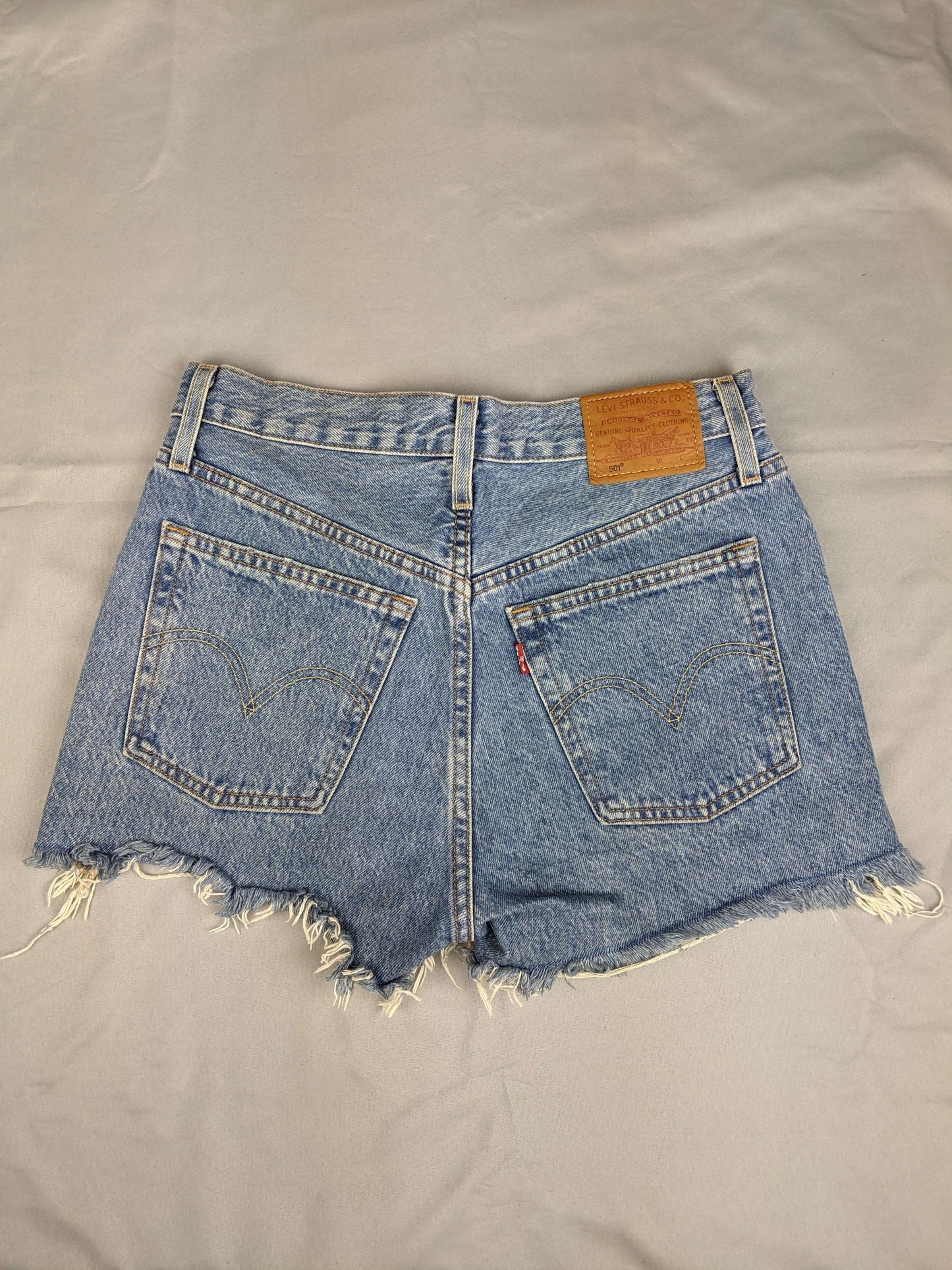 Back view of Levi's blue denim shorts