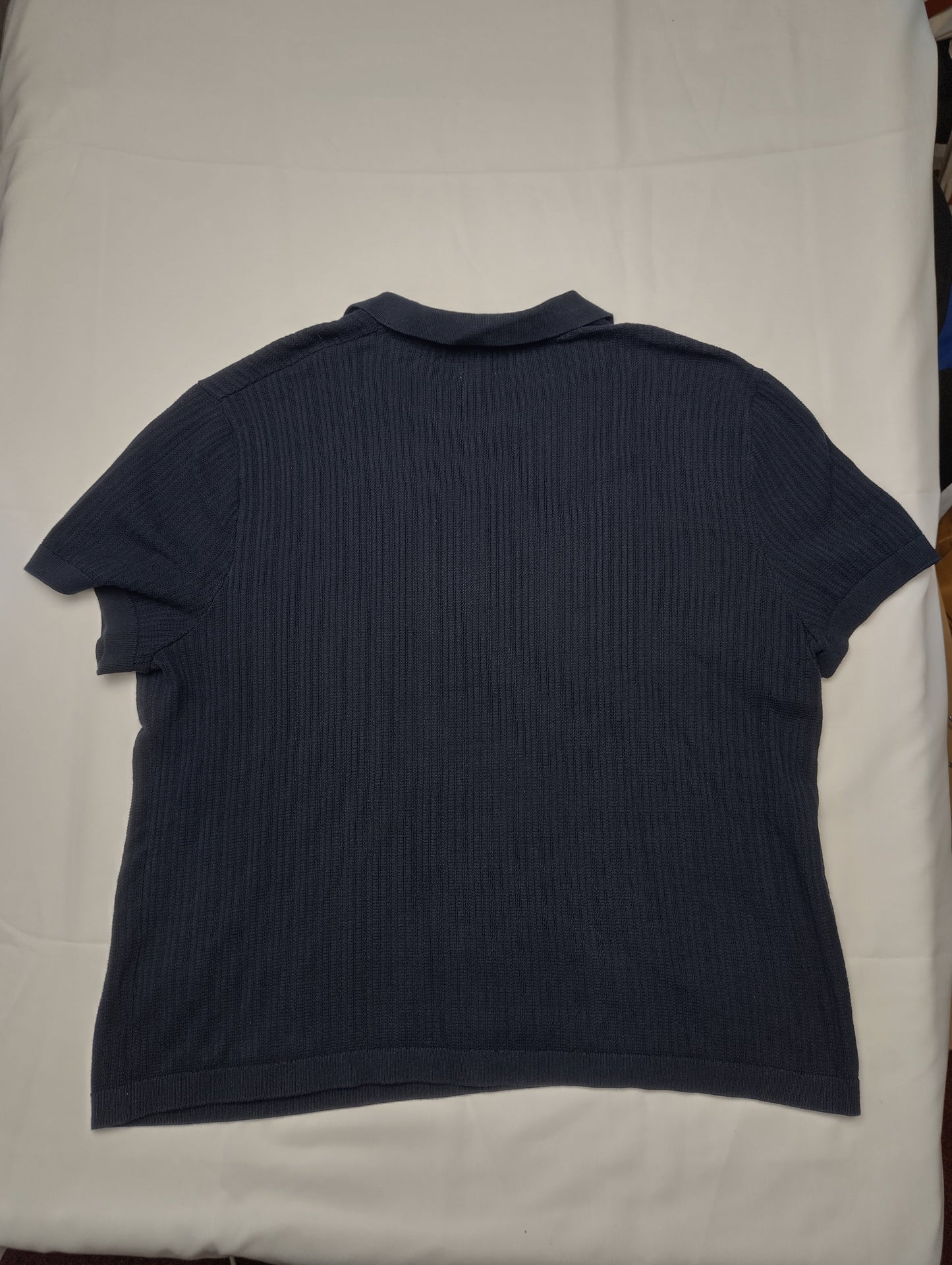 Back view of H&M navy polo shirt