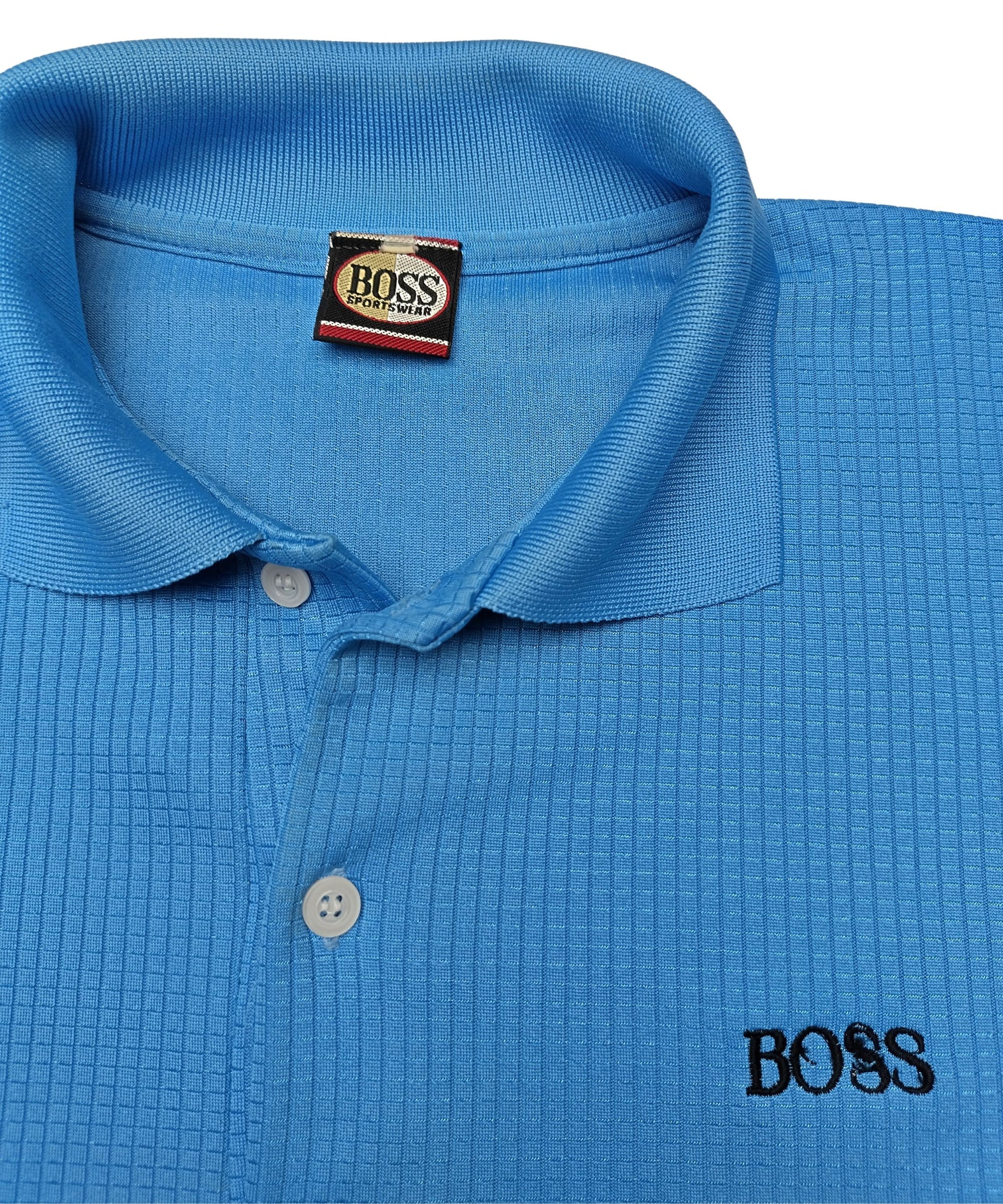 Close-up of collar and logo on blue BOSS polo shirt