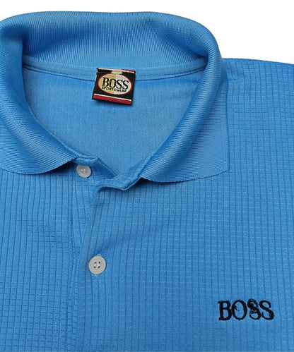 Close-up of collar and logo on blue BOSS polo shirt