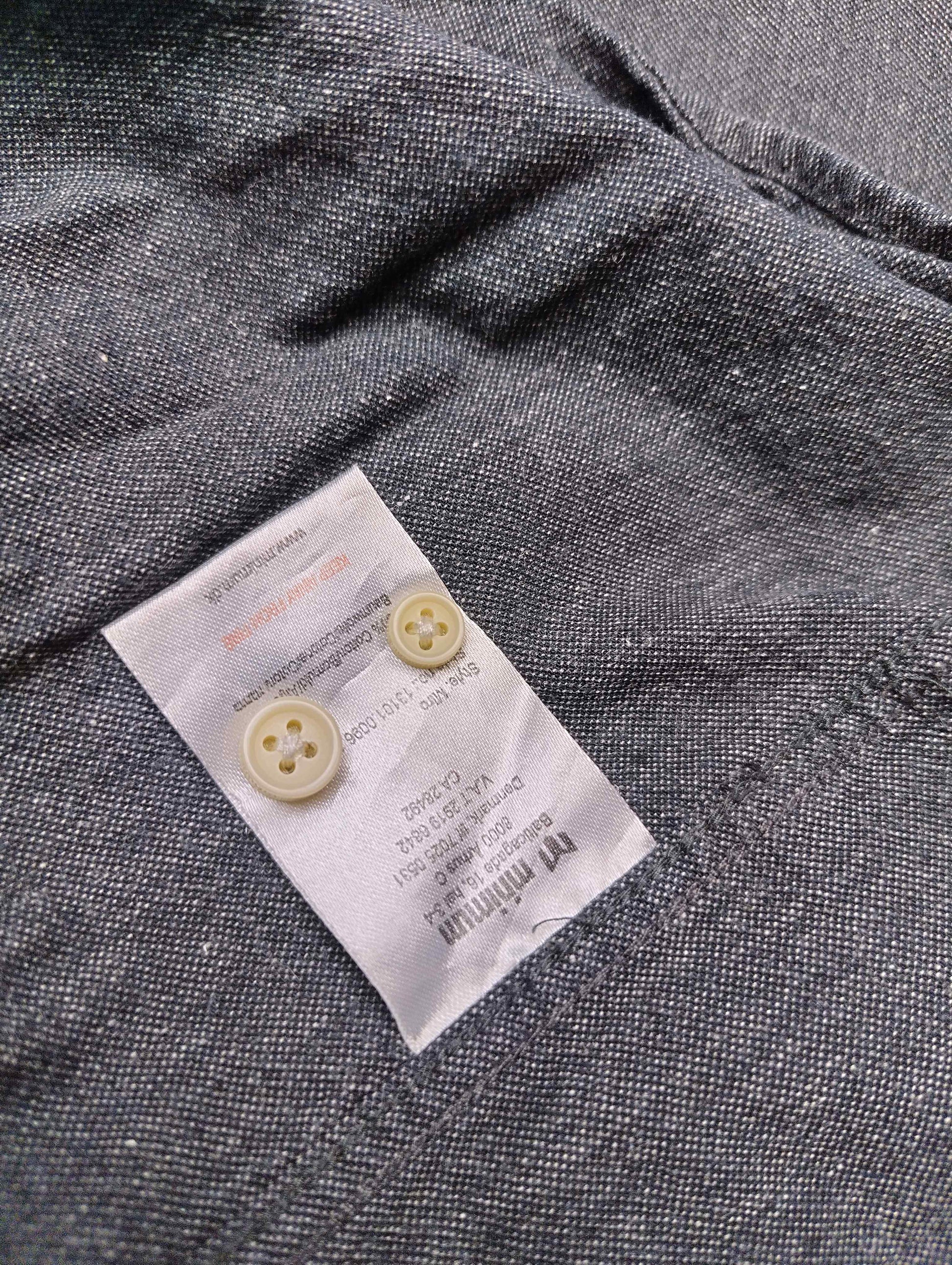Fabric care label with buttons