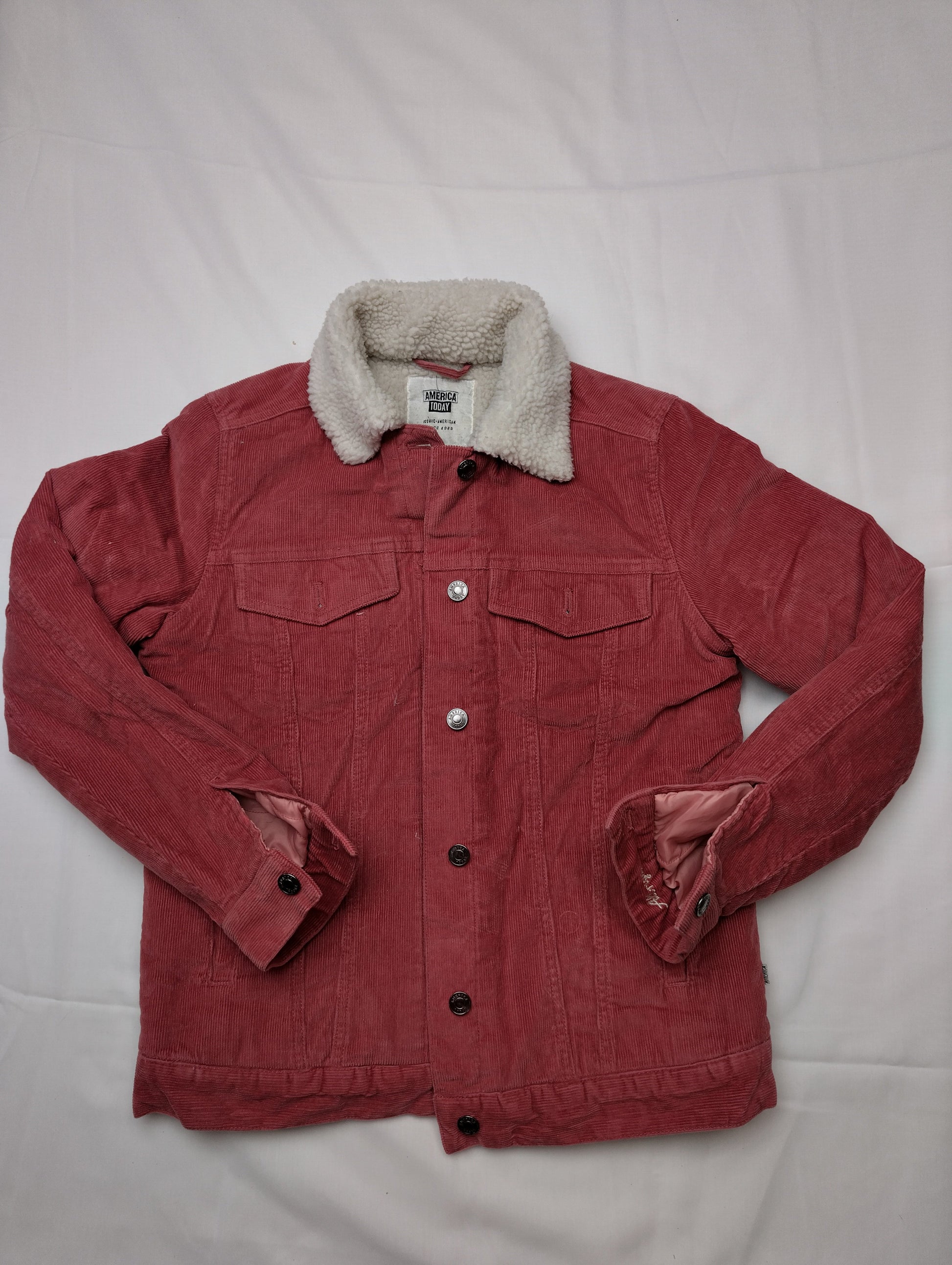 Jacket laid out with sleeves slightly raised