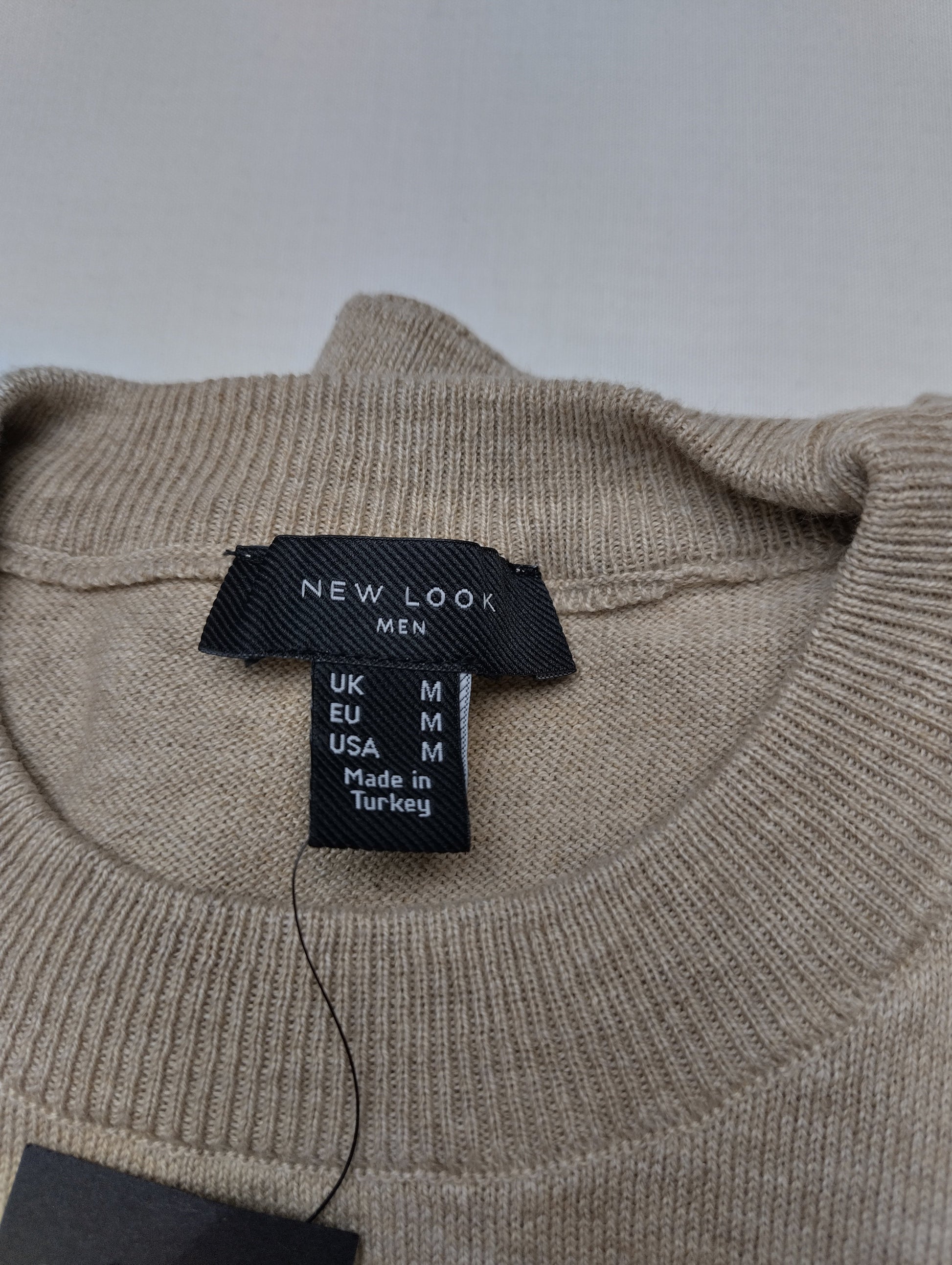 Close-up of sweater label