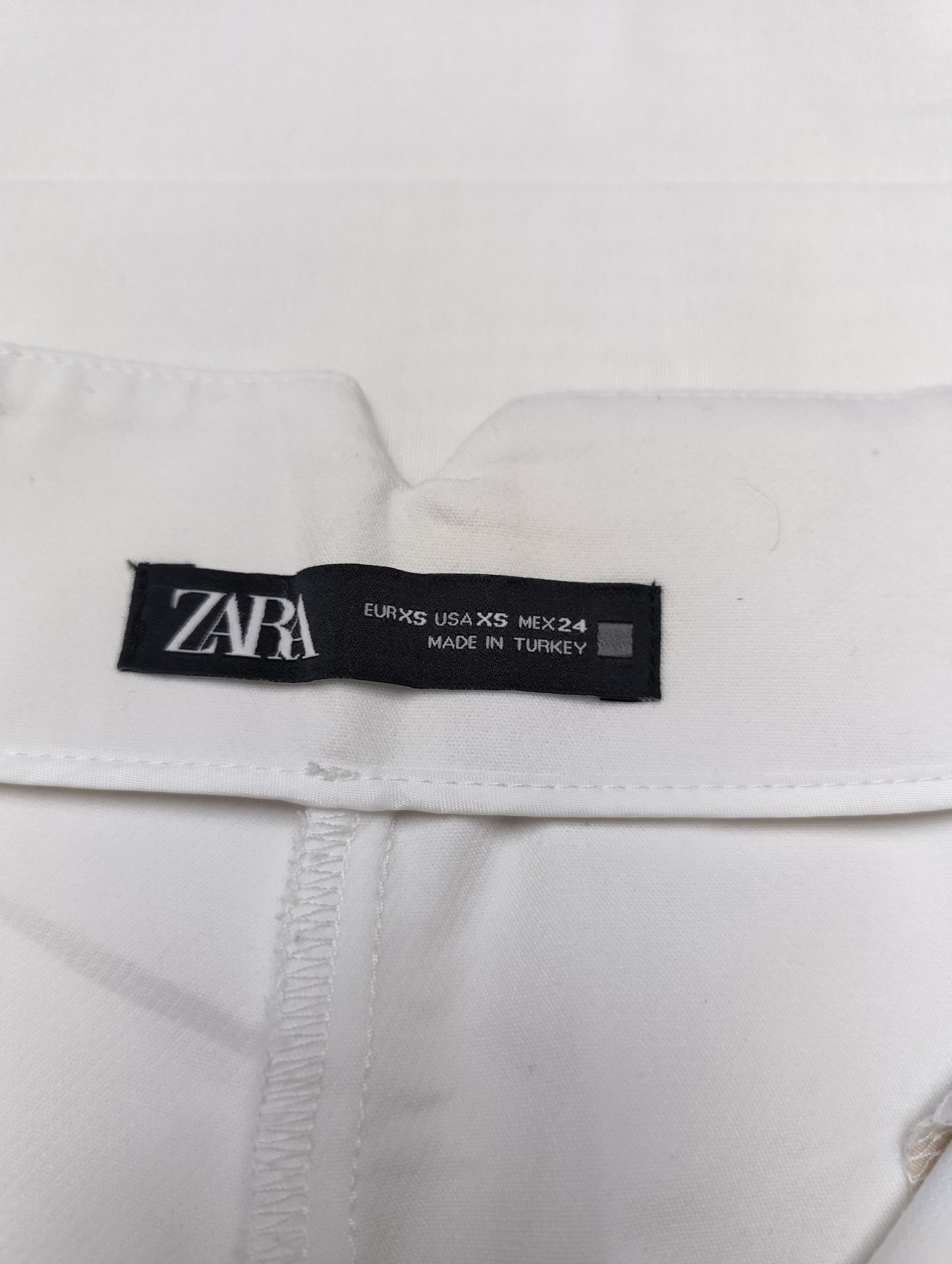 Label showing size and brand inside the trousers