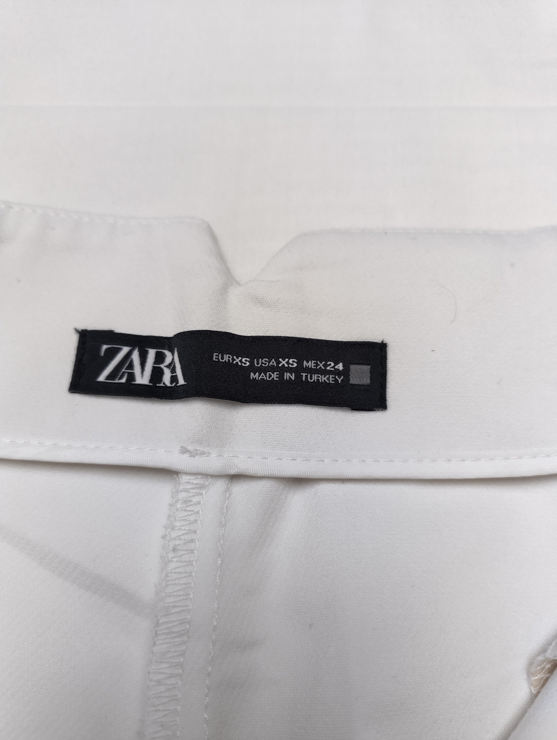 Label showing size and brand inside the trousers