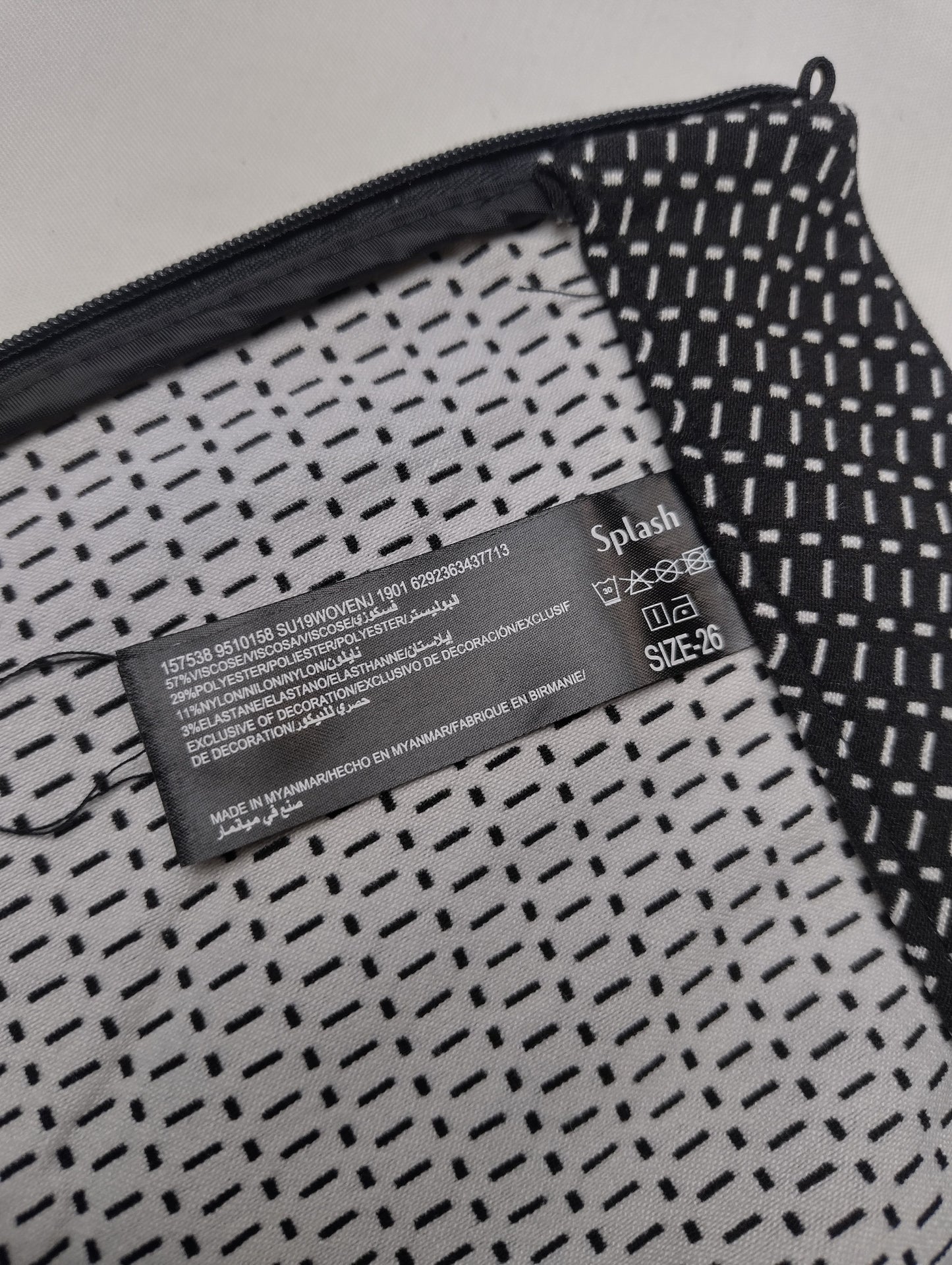 Close-up of the leggings showing the tag and fabric pattern