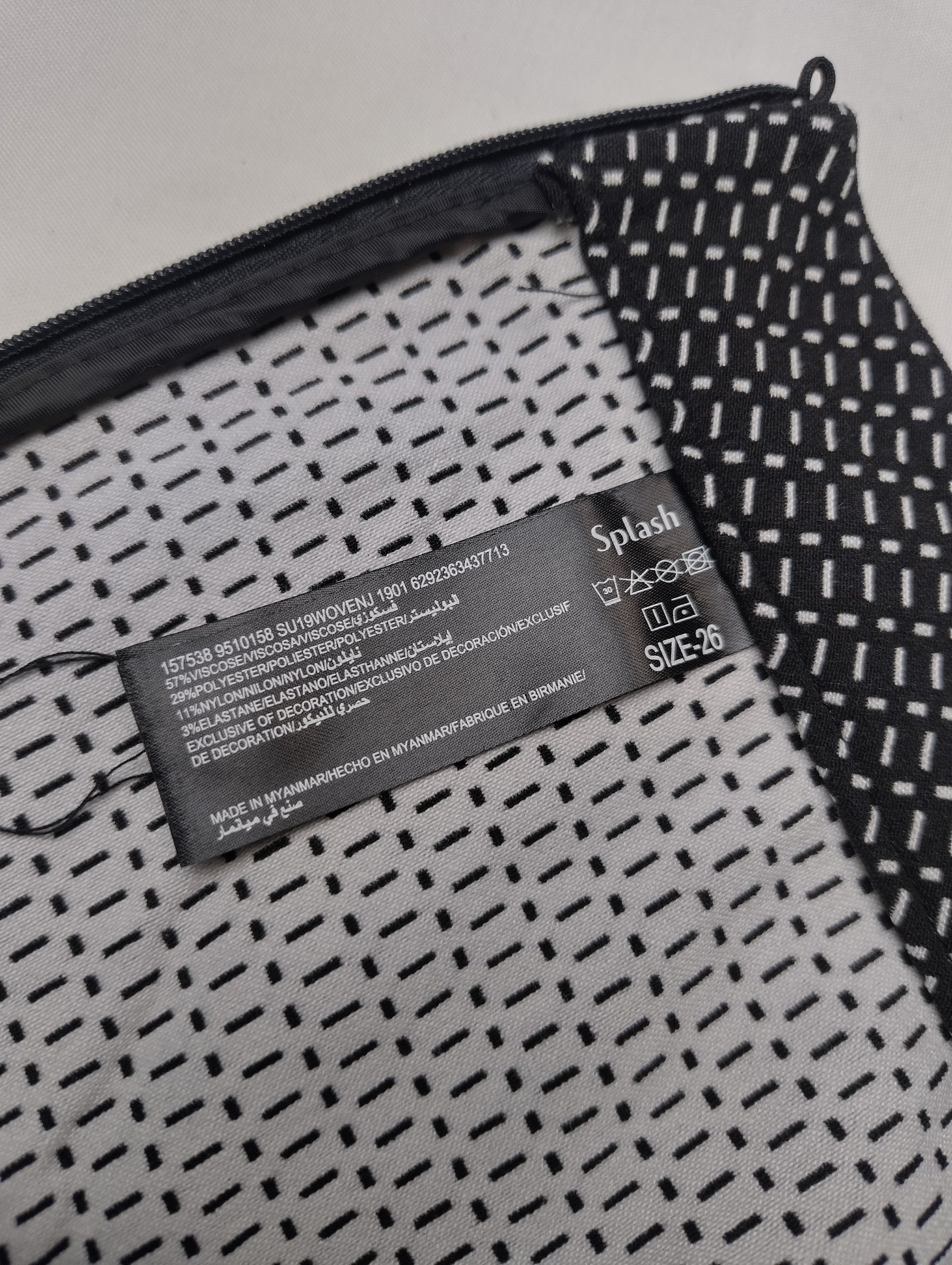 Close-up of the leggings showing the tag and fabric pattern