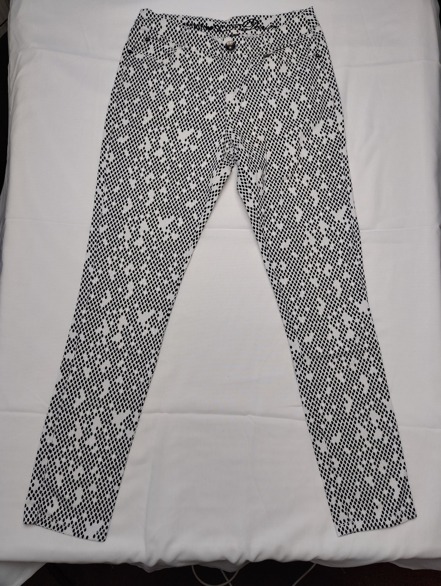 Front view of black and white polka dot pants