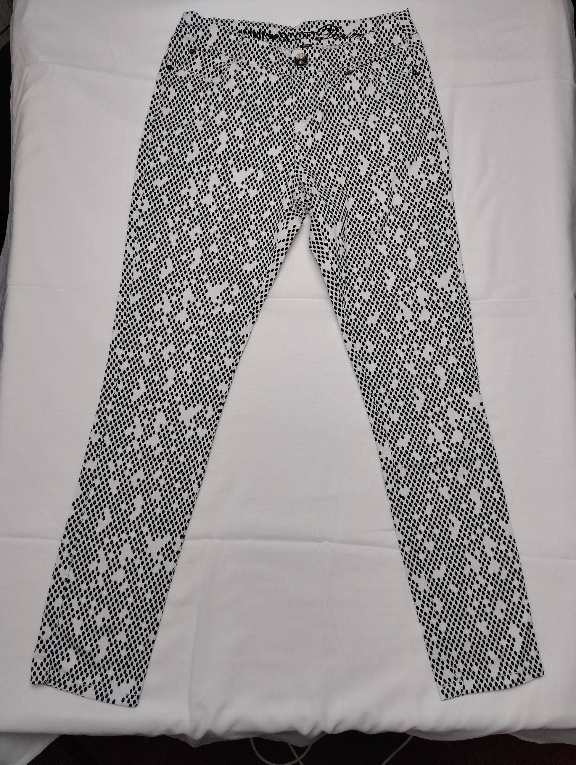 Front view of black and white polka dot pants