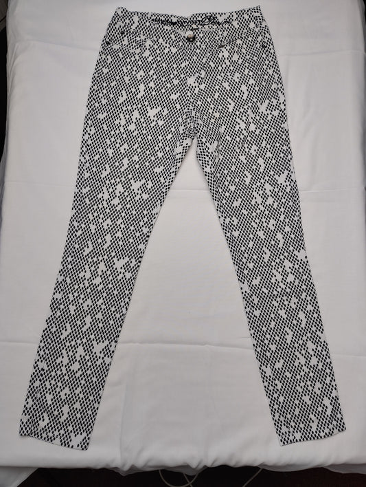 Front view of black and white polka dot pants