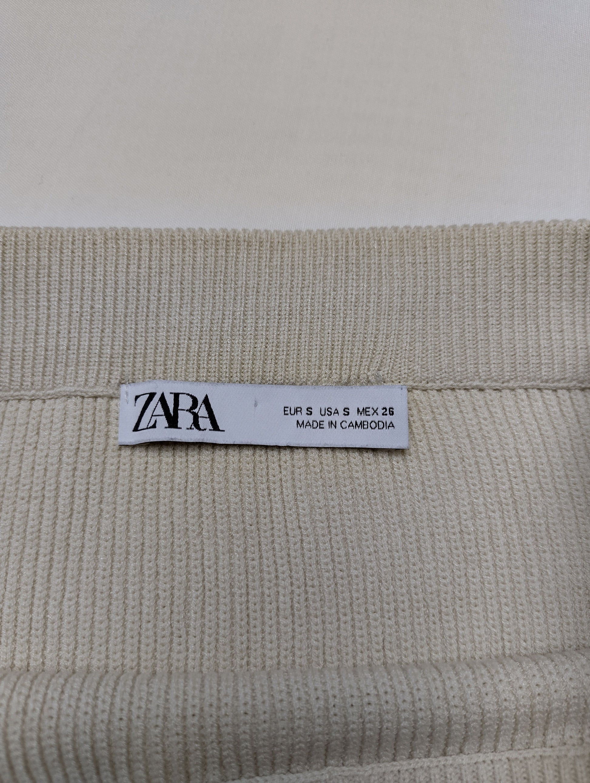 Zara clothing label showing size and origin