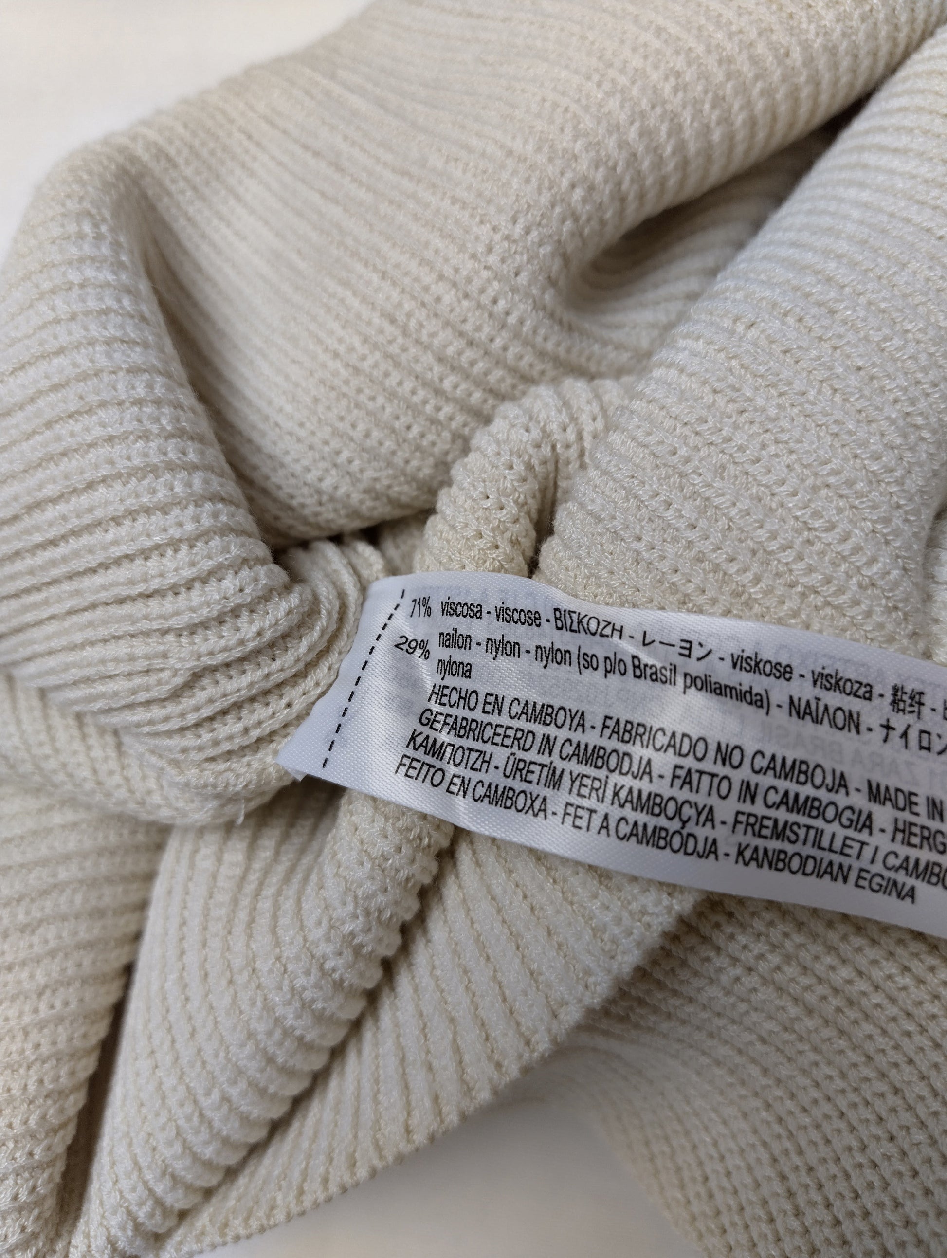 Close-up of fabric content label showing composition