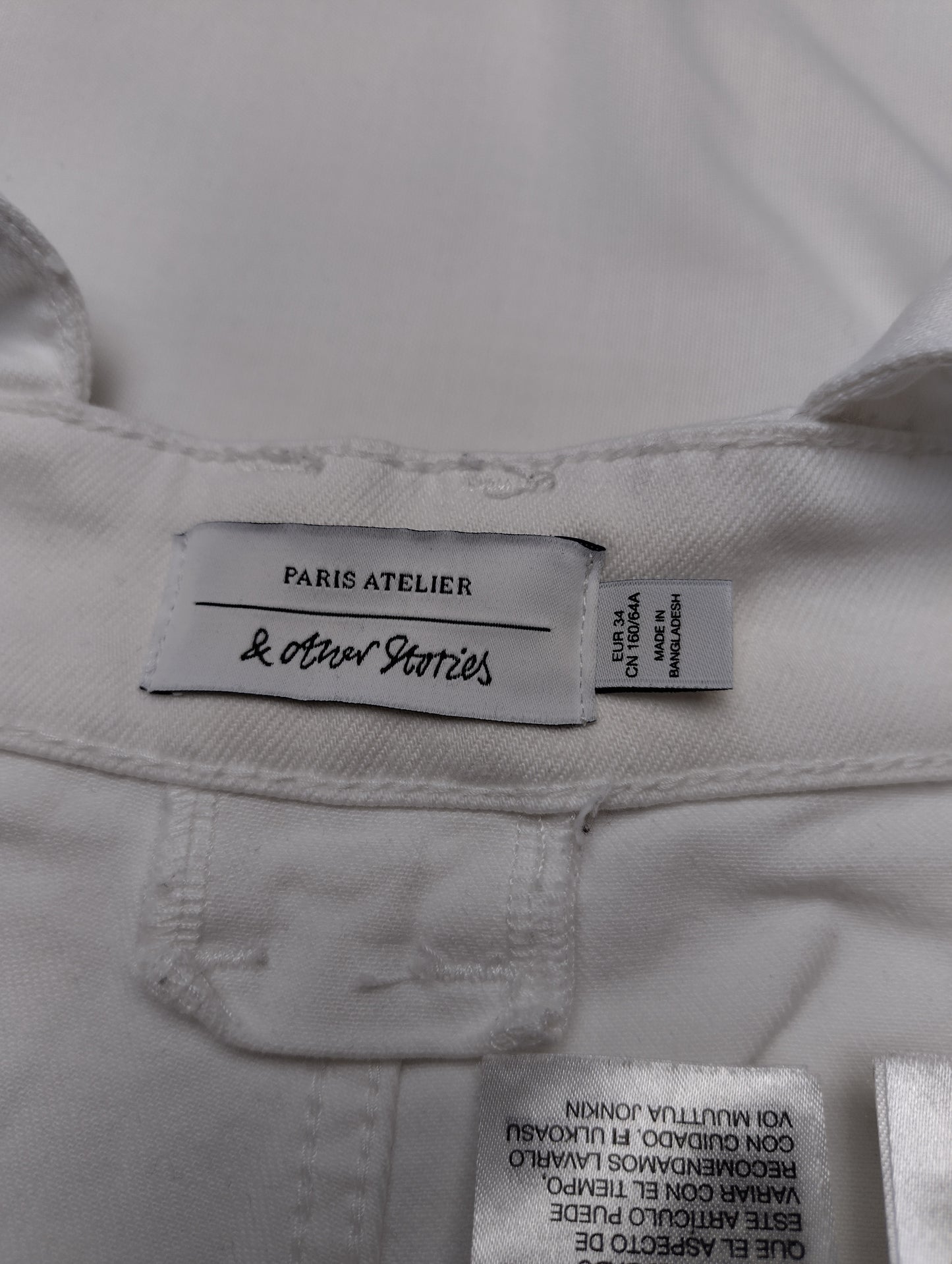 Tag details of white overalls