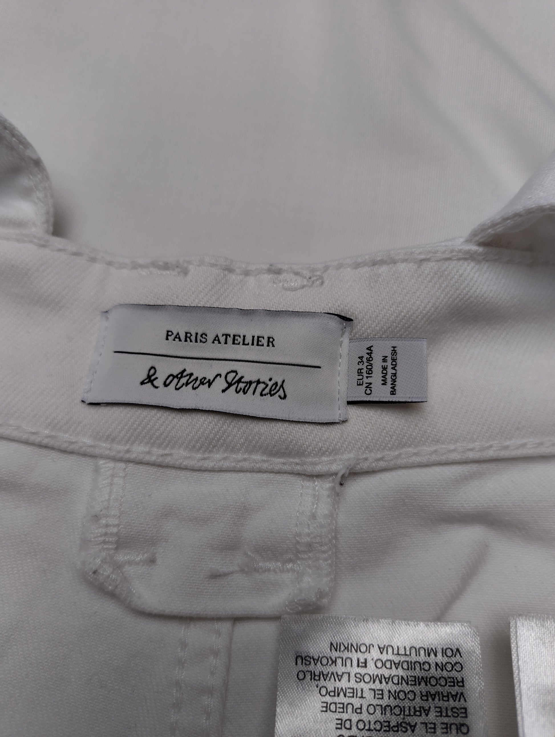 Tag details of white overalls