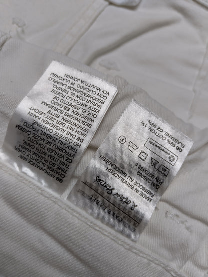 Care instructions label of white overalls