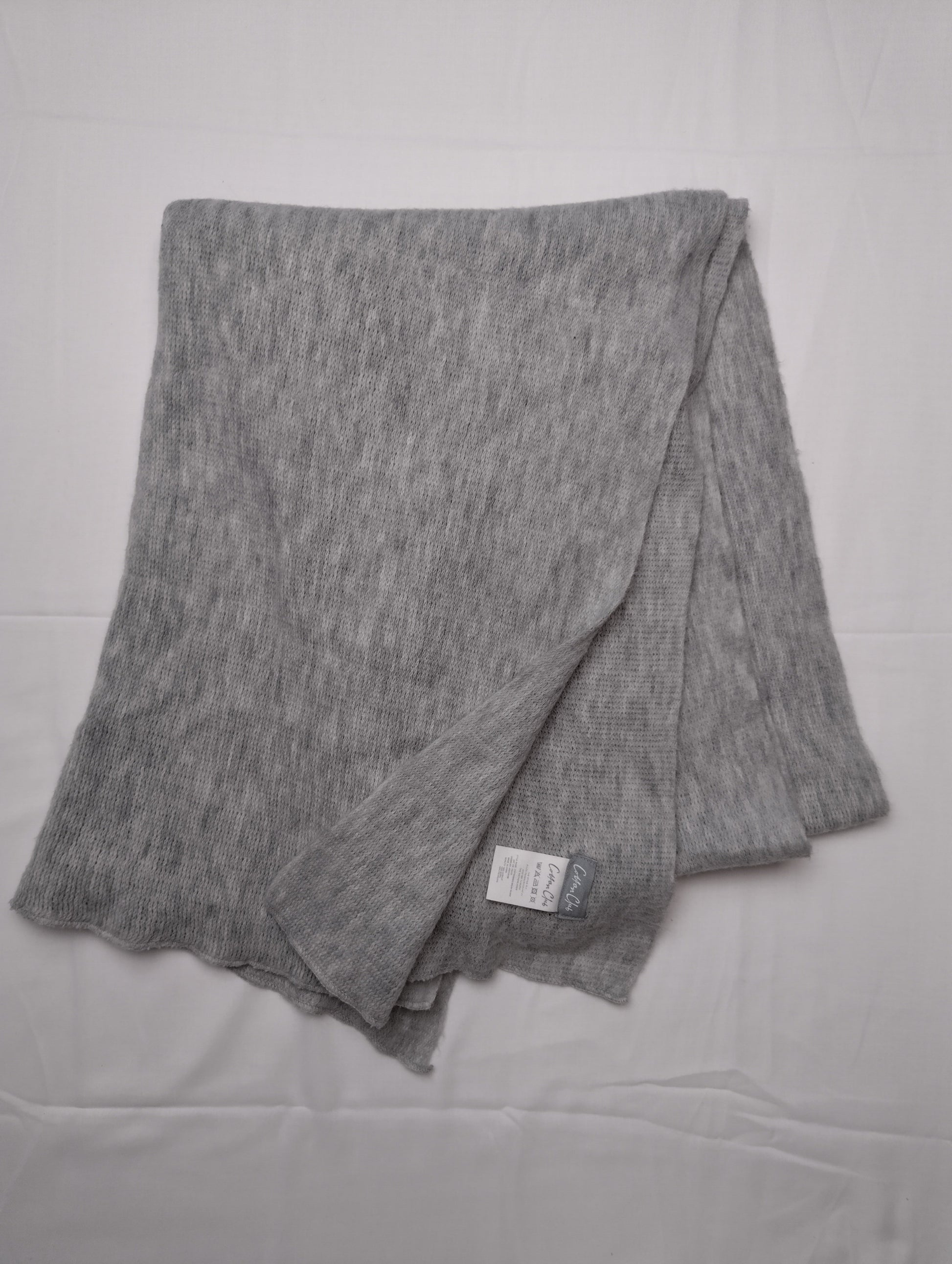 Flat lay of a grey scarf
