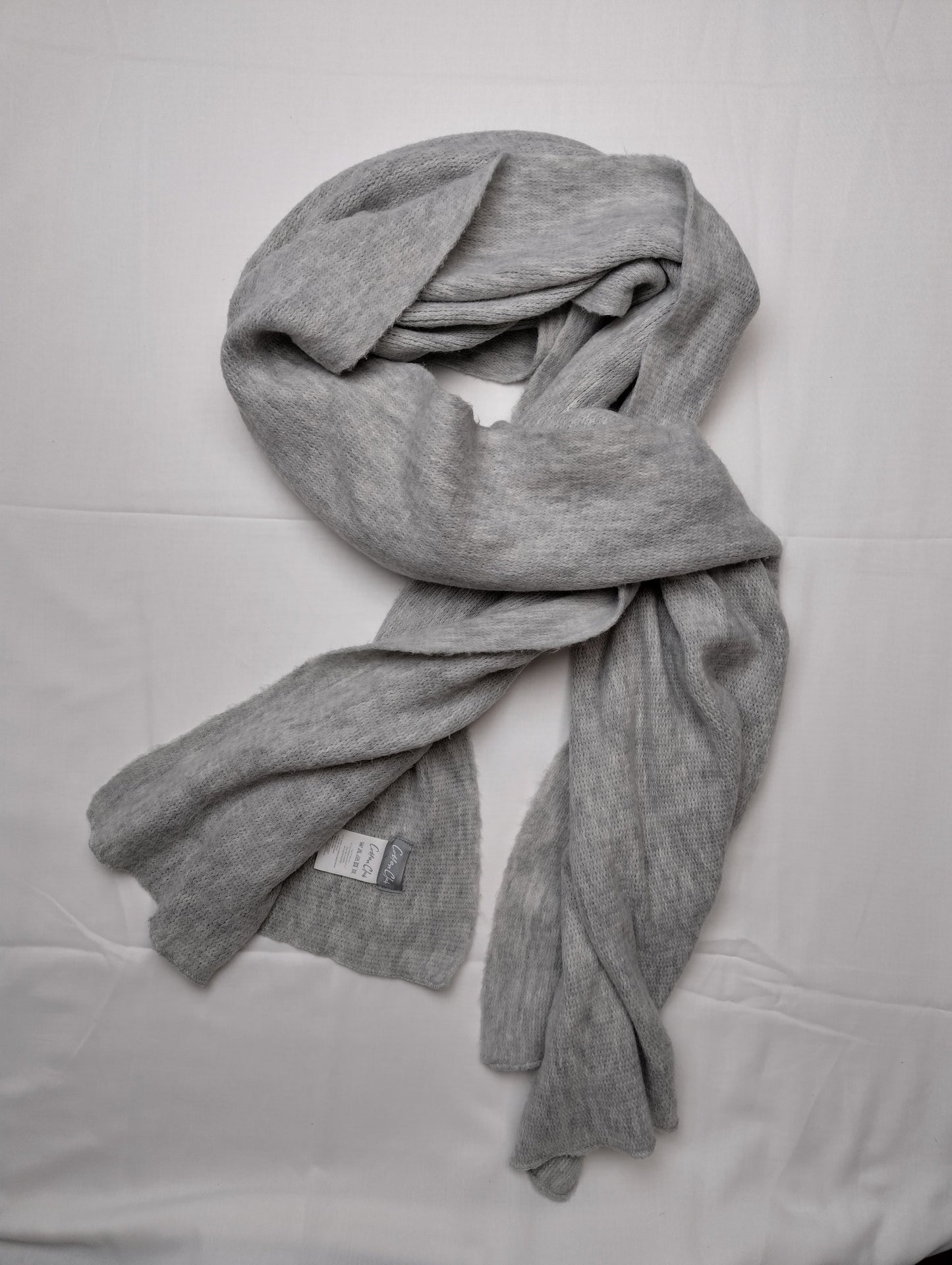 Grey scarf styled in a wrap