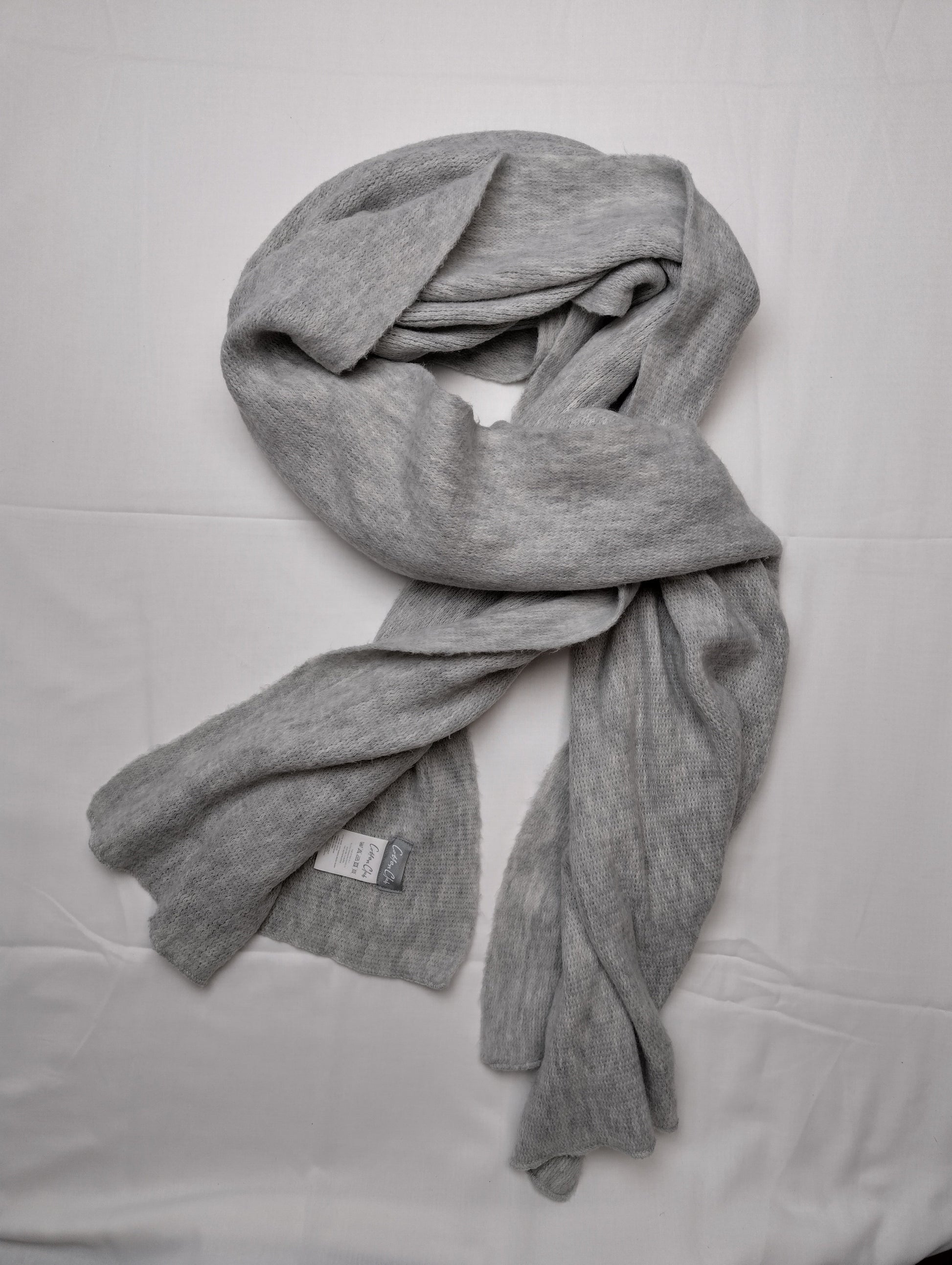 Grey scarf styled in a wrap