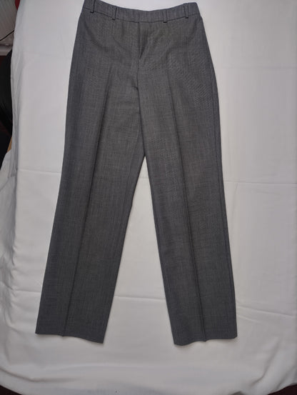 Full view of grey dress pants on a white background
