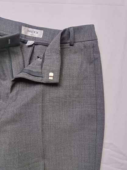 Detail view of waistband and closure of grey dress pants