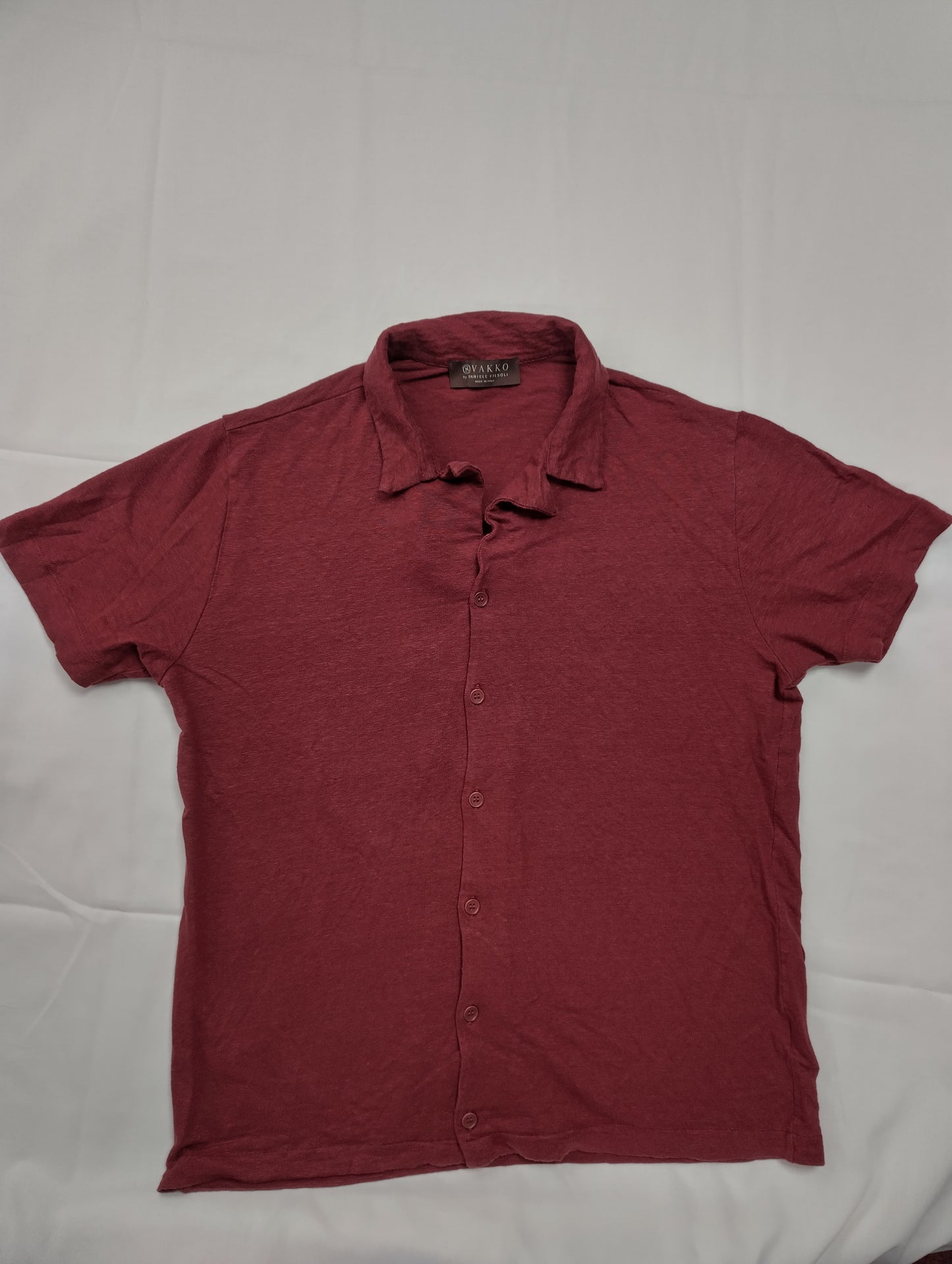Maroon button-up shirt flat lay