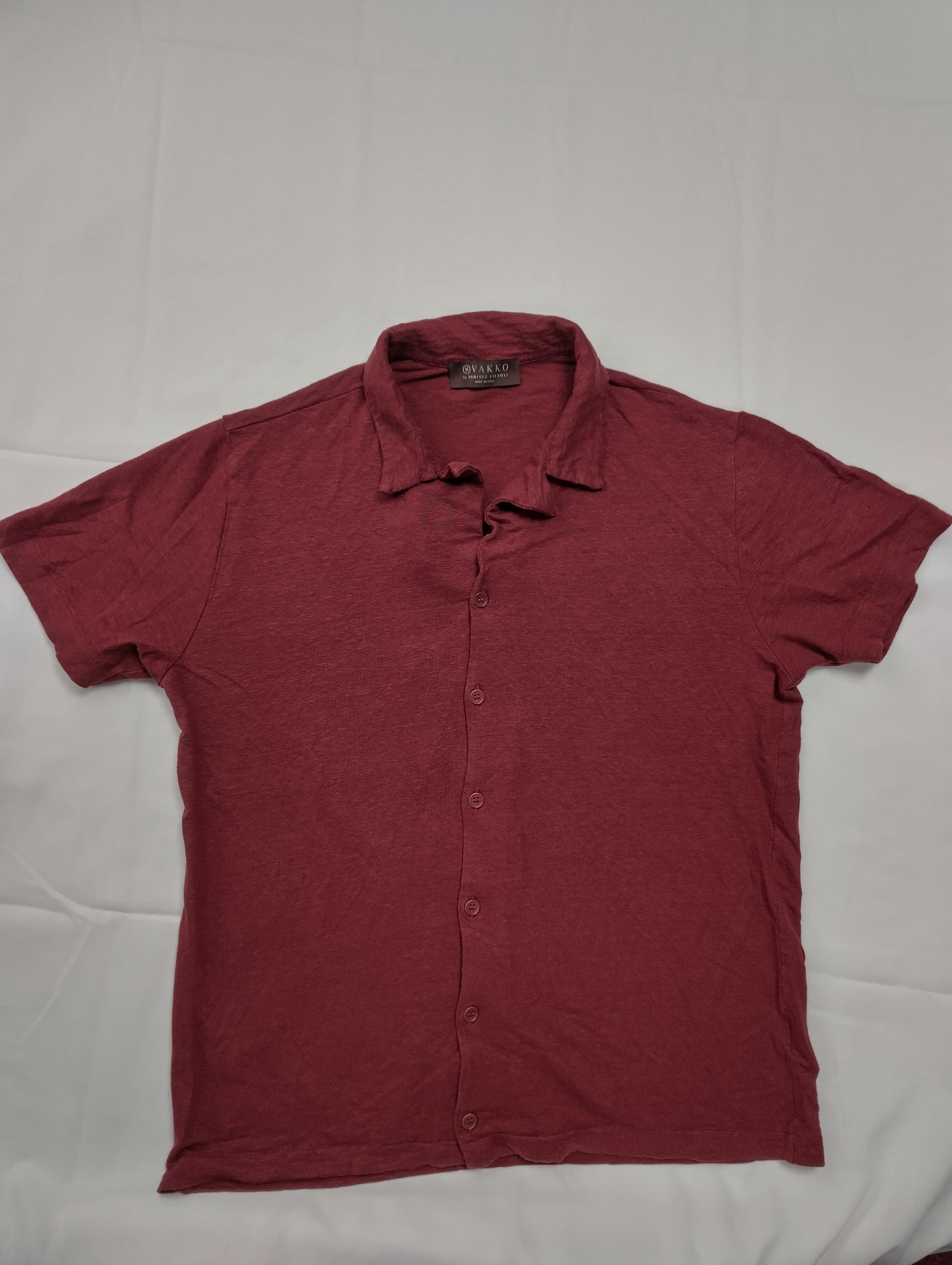 Maroon button-up shirt flat lay