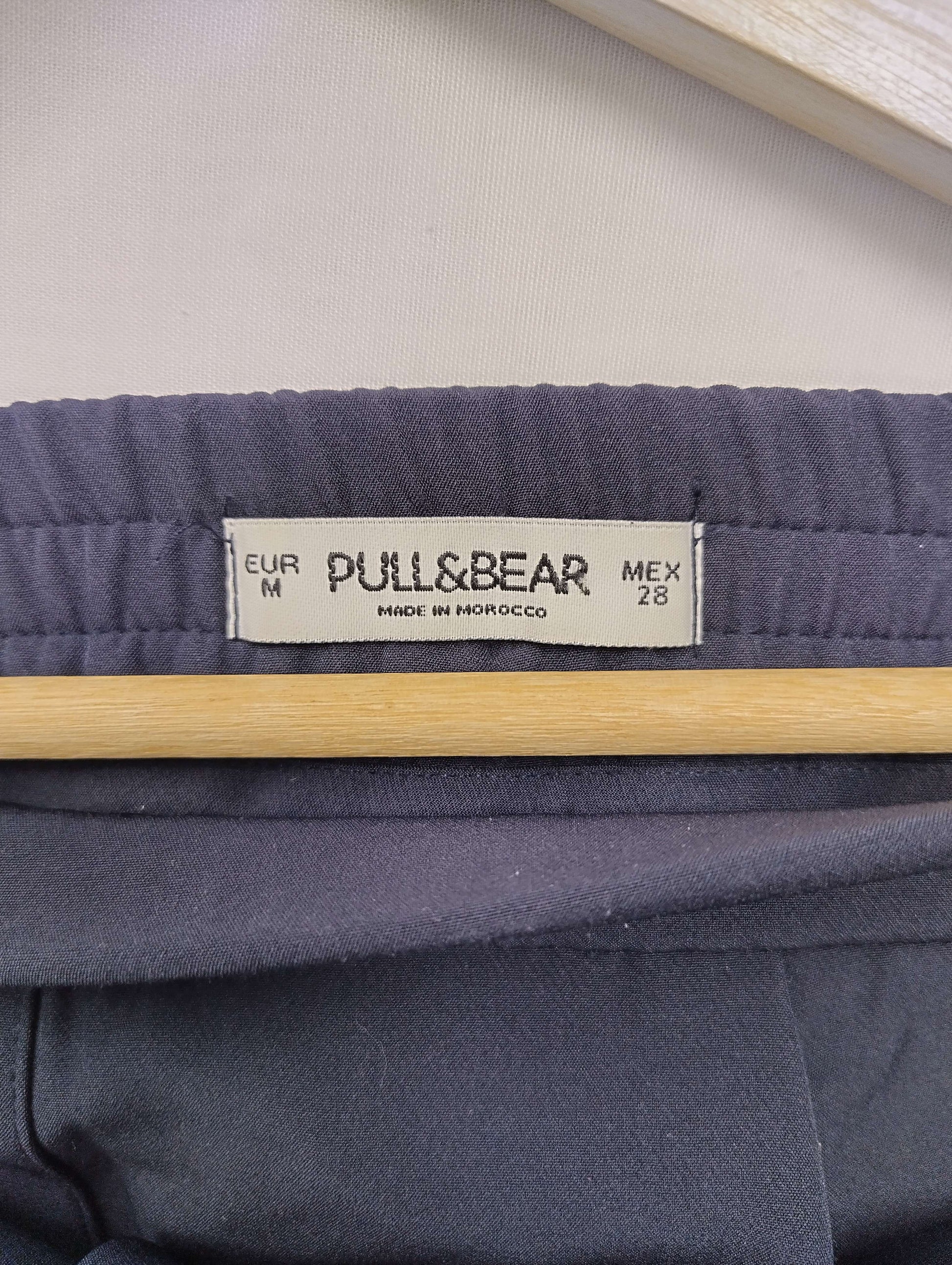 Close-up of Pull&Bear label on navy pants