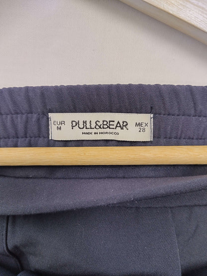 Close-up of Pull&Bear label on navy pants