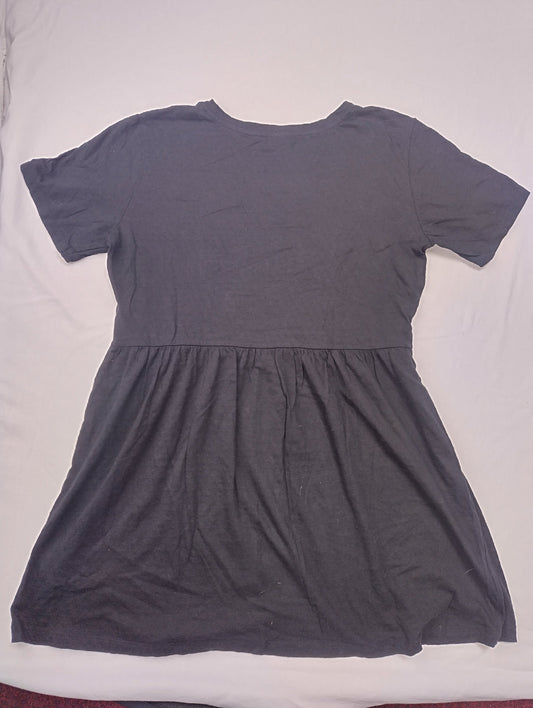 Flat view of the black dress laying on a surface