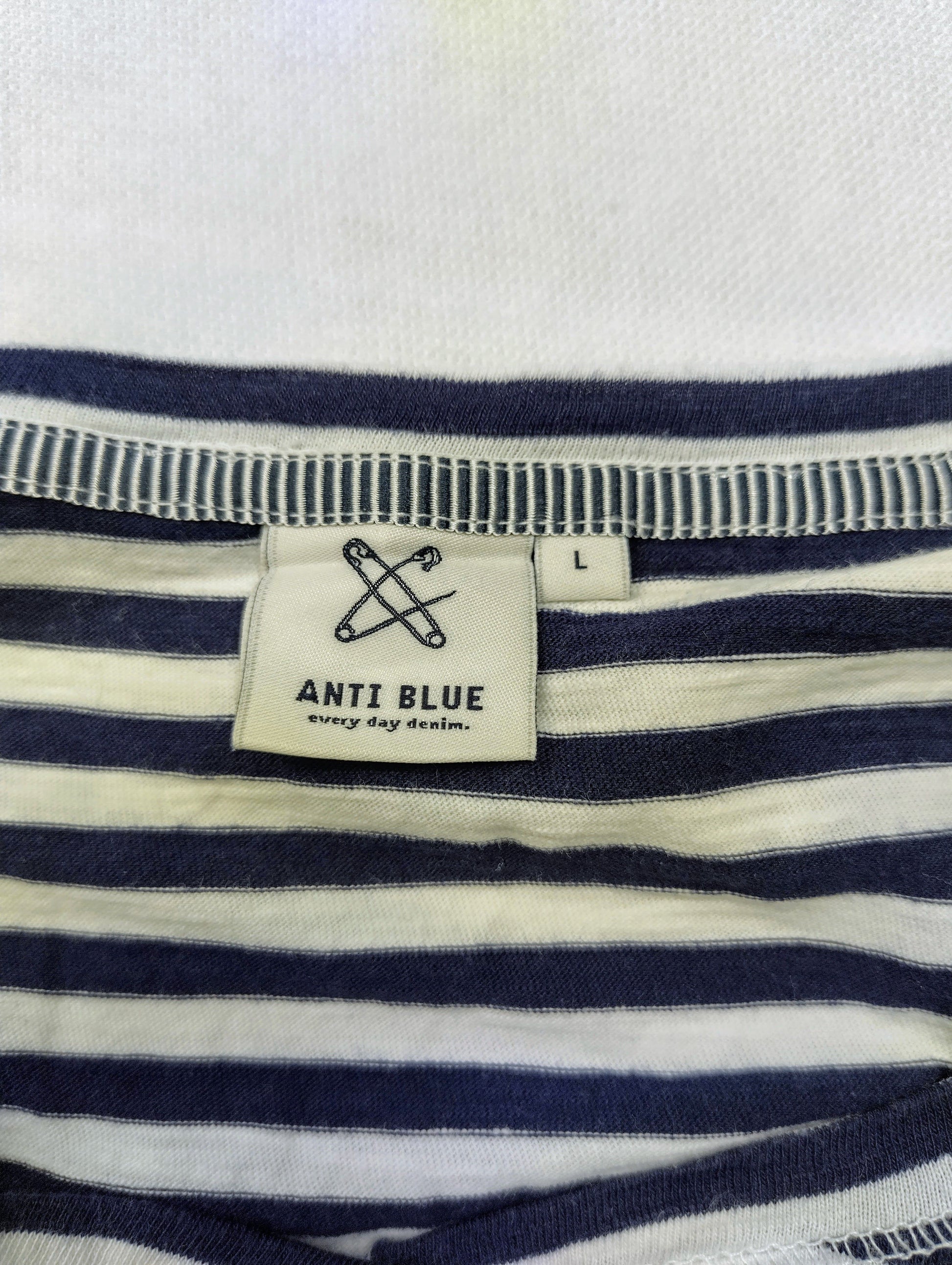 Label of Anti Blue navy striped tee