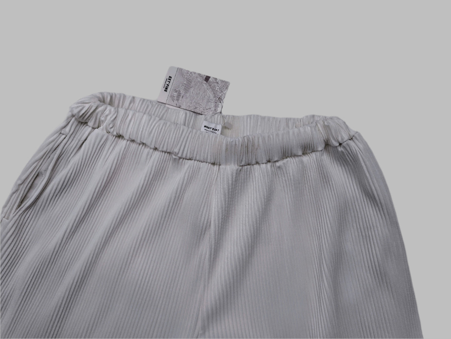 Top view of the white pants showing the textured fabric