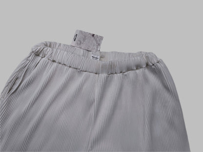 Top view of the white pants showing the textured fabric