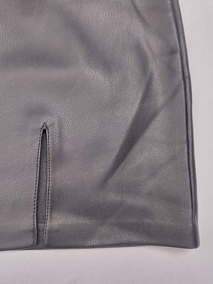 Detail of gray faux leather skirt hem