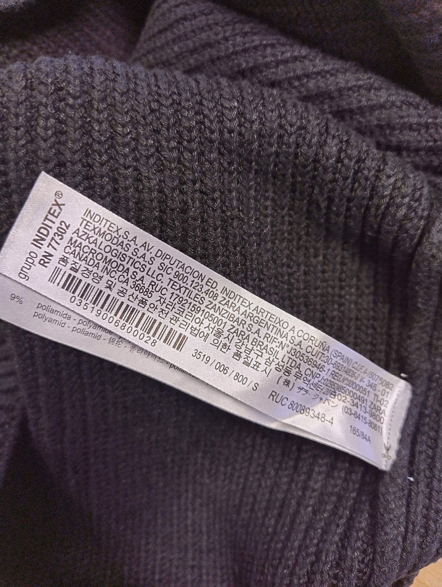 Close-up of the care label in the knit top