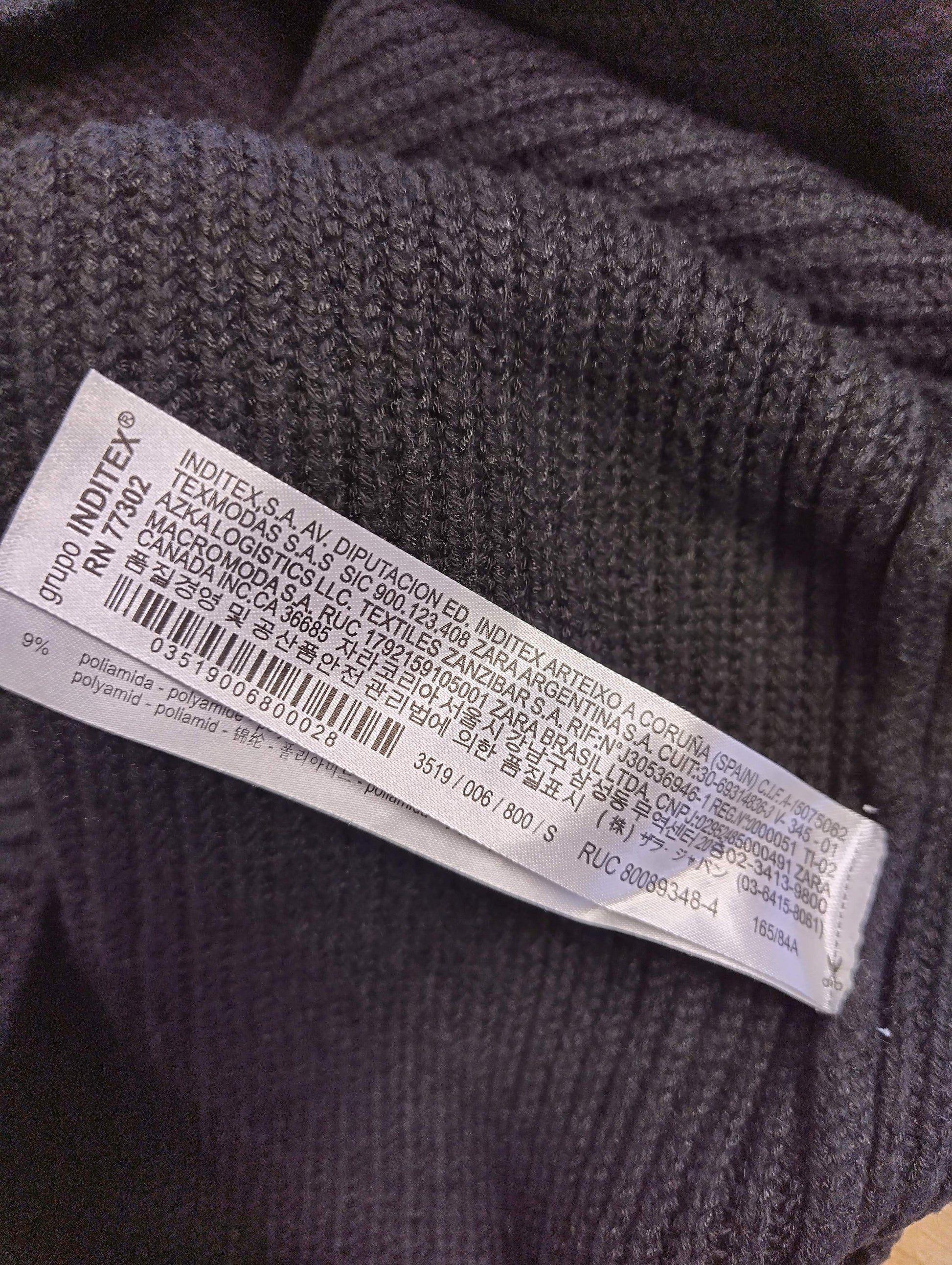 Close-up of the care label in the knit top