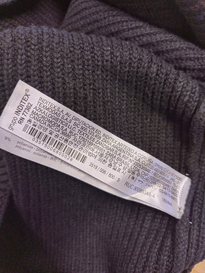 Close-up of the care label in the knit top