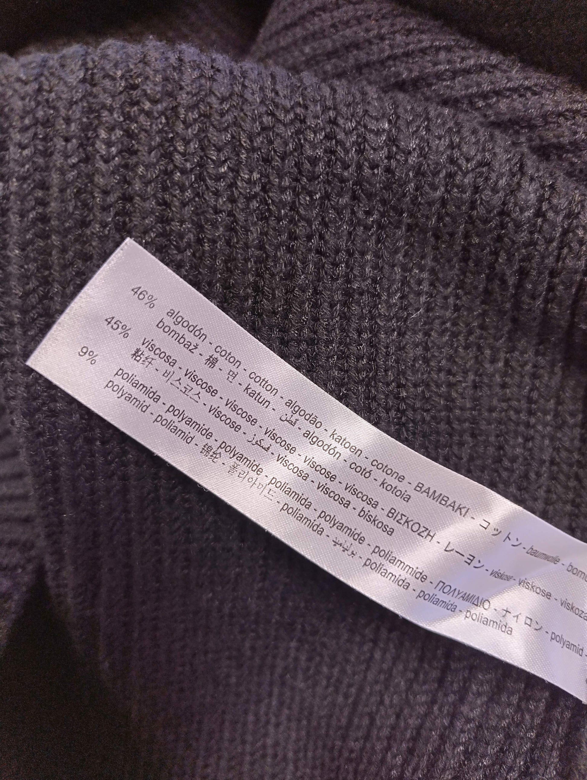 Close-up showing fabric composition of the knit top