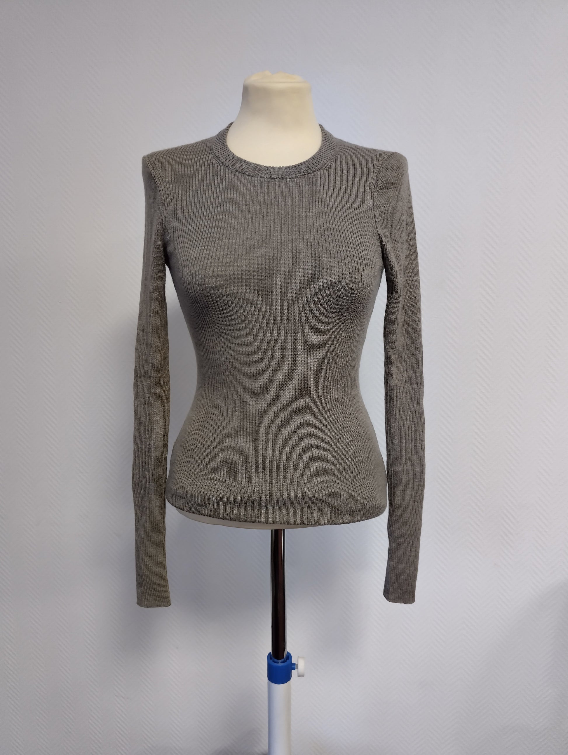Front view of the grey ribbed sweater