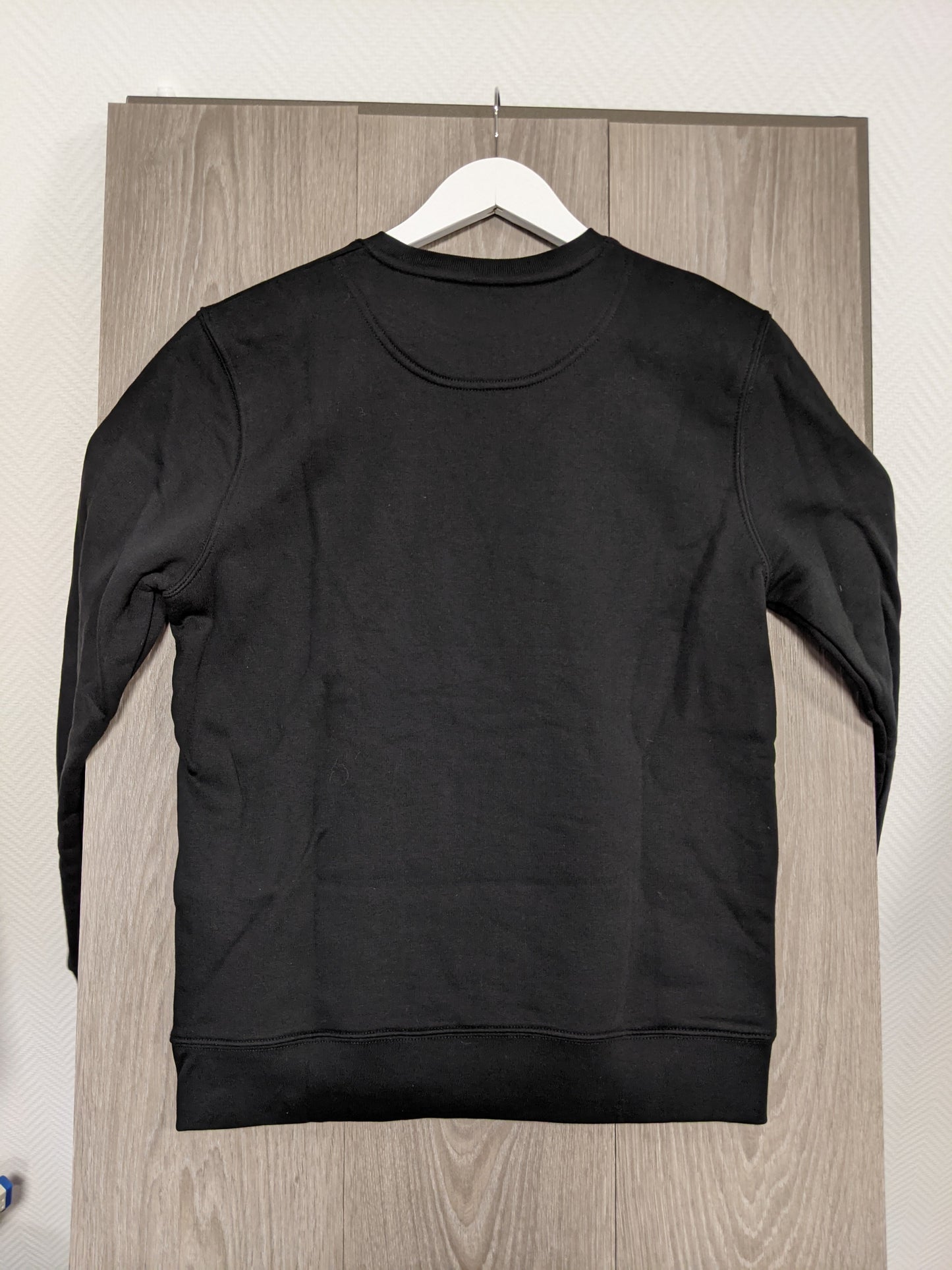 Back view of black sweatshirt