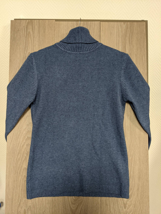 Back view of a blue turtleneck sweater
