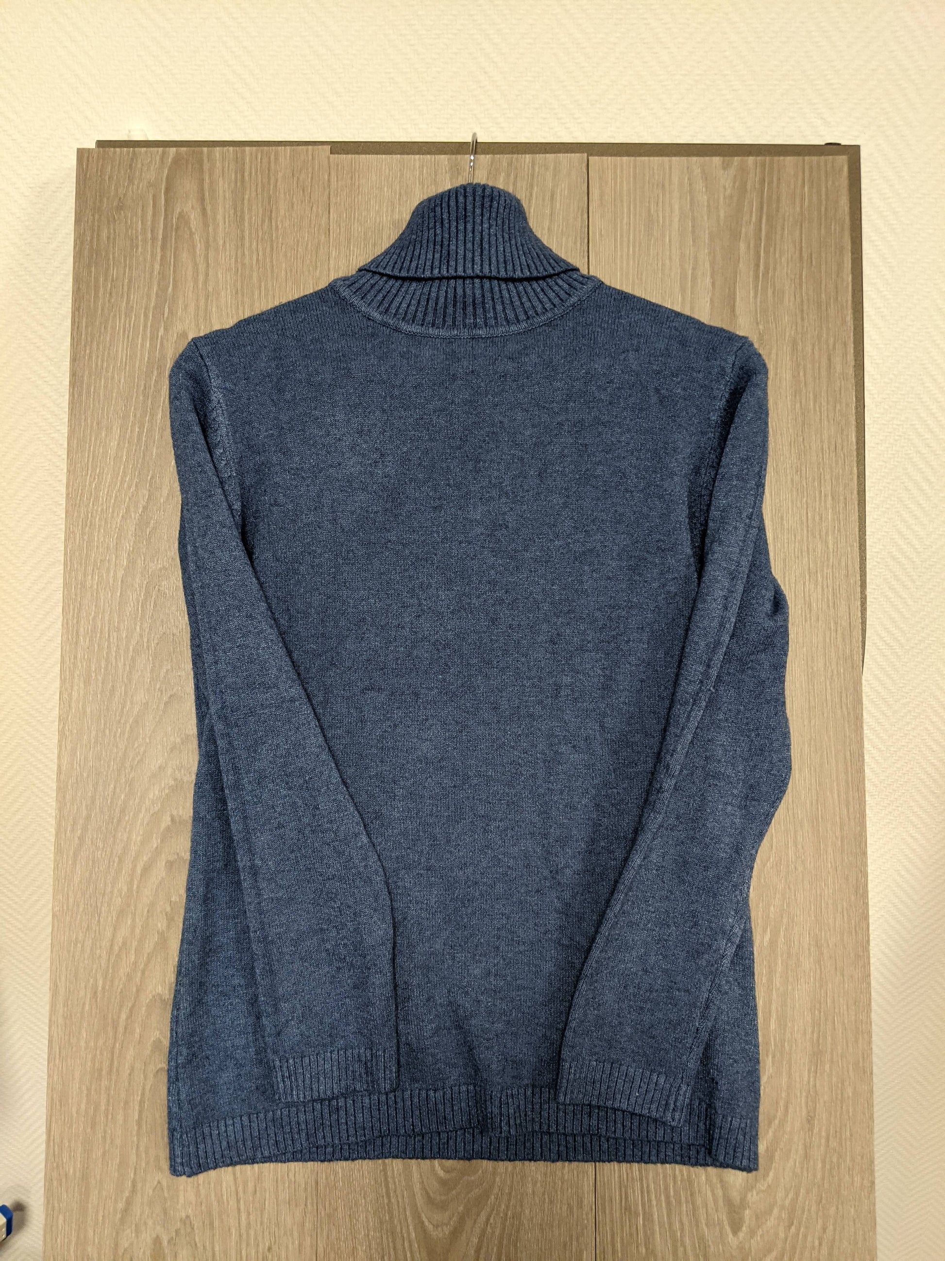 Another angle of the blue turtleneck sweater
